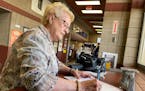 Karen Schaar, 76, of Bemidji, takes Mother's Day cards for her daughters to the Bemidji post office Wednesday. For years, she has paid extra for prior