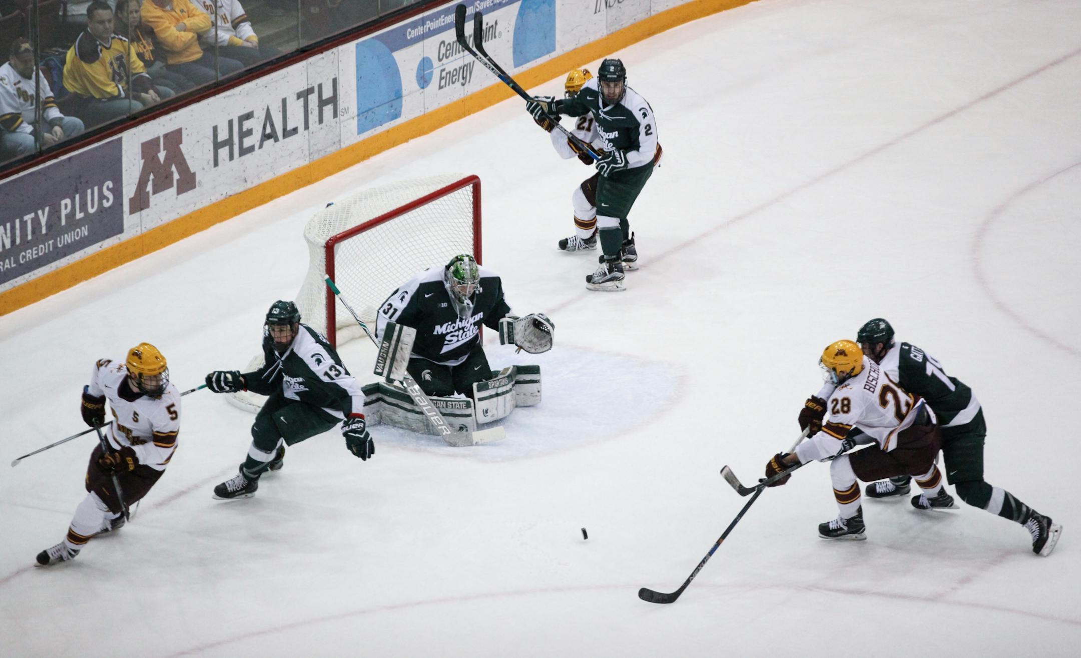 Minnesota Gophers� Jake Bischoff (28) tries to shoot the puck in the second period.