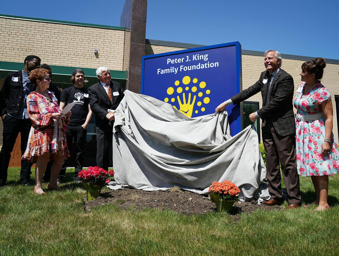 A new sign was unveiled at YouthLink in Minneapolis during the Peter J. King Foundation dedication. At right are Russell King, the foundation president, and his wife Andrea. On the left is Dr. Heather Huseby, the executive director of YouthLink. ] Shari L. Gross &#xa5; shari.gross@startribune.com YouthLink, a Minneapolis nonprofit that helps homeless teens and young adults, is celebrating a major renovation after completing a $6 million fundraising campaign. The nonprofit opened in a dark, forme