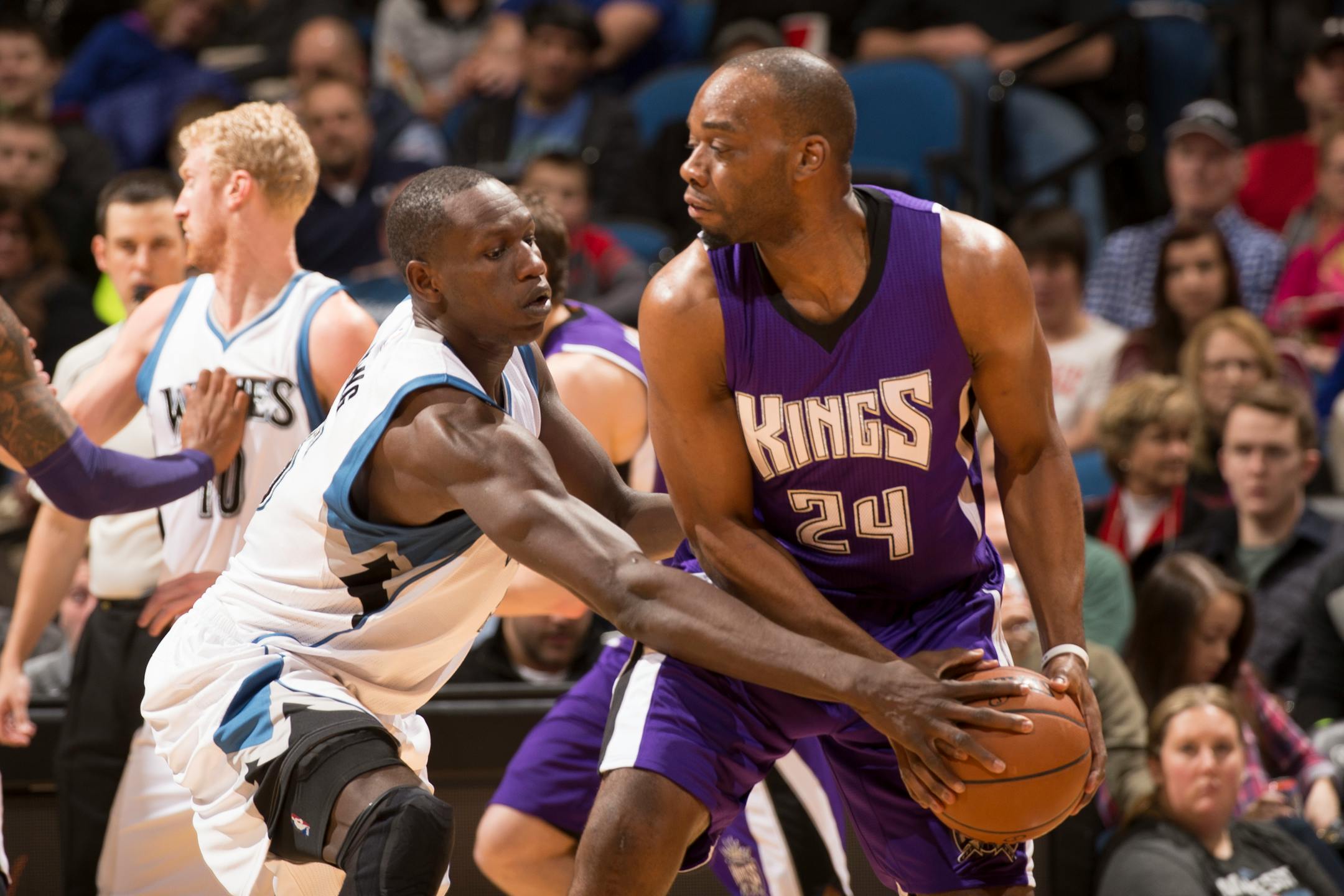 Minnesota Timberwolves center Gorgui Dieng (5) gets his hand on the ball while defending against Sacramento Kings forward Carl Landry (24) during the first quarter.