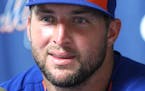 Tim Tebow talks during a press conference after his first instructional league baseball game for the New York Mets against the St. Louis Cardinals ins
