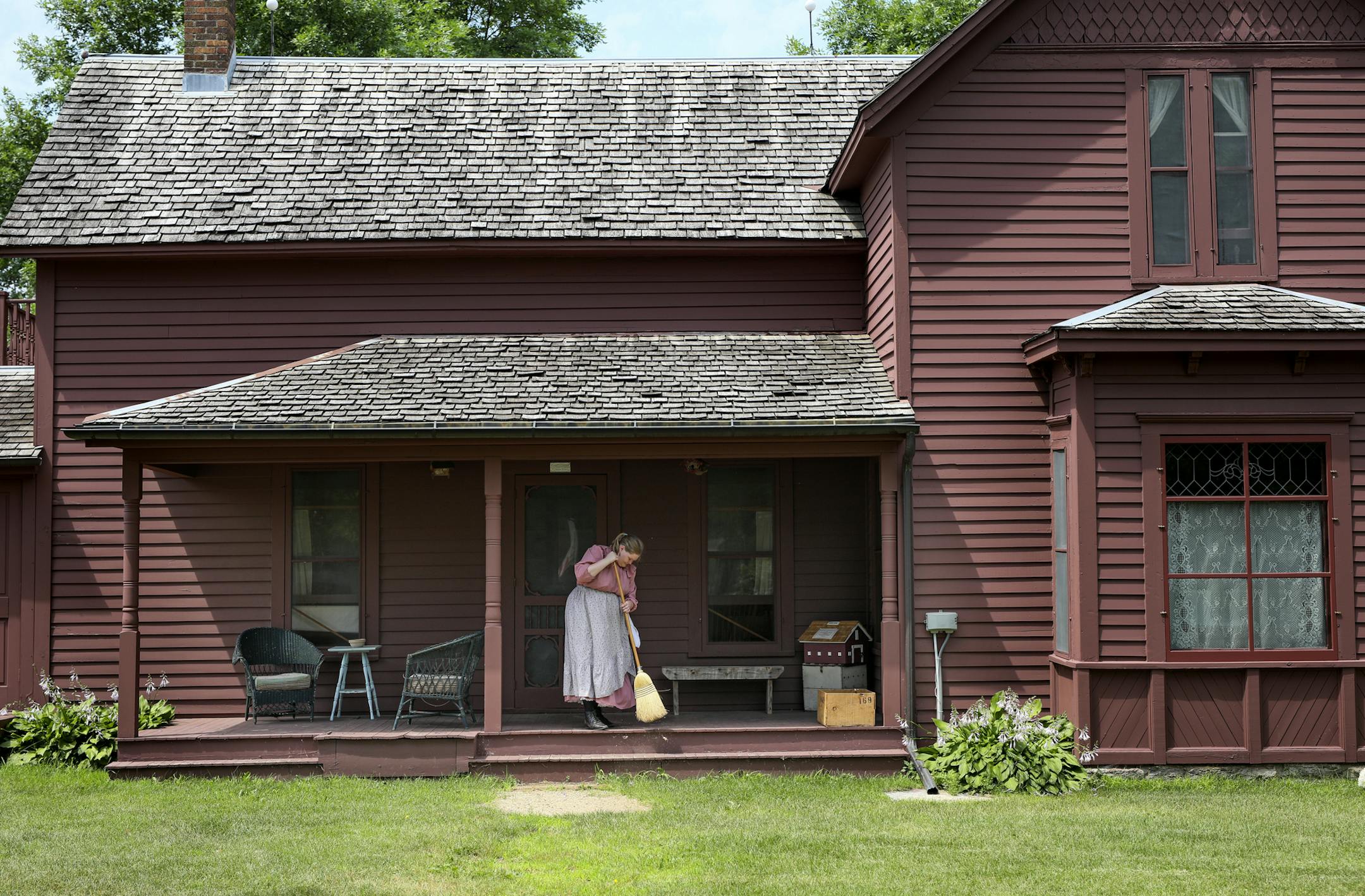 Eidem Farm, a historical homestead in Brooklyn Park, will likely get the go ahead from the city to start an $8.5 million master renovation plan. Here, Haley Sjerven sweeps the porch at the Eidem homestead. ] BRIAN PETERSON &#xa5; brian.peterson@startribune.com
Brooklyn Park, MN 07/11/2018
