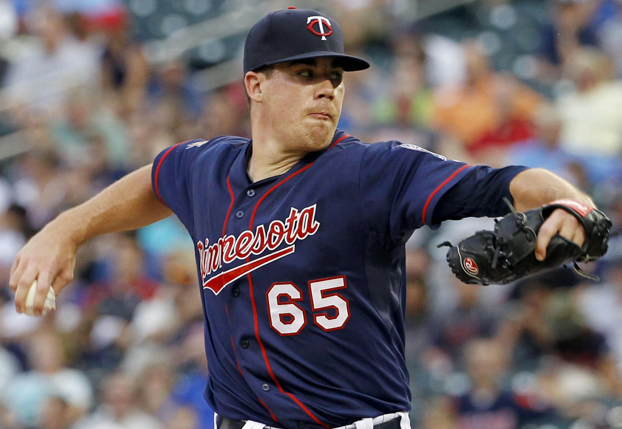 Minnesota Twins starting pitcher Trevor May delivers to the Kansas City Royals during the first inning of a baseball game in Minneapolis, Monday, Aug. 18, 2014. (AP Photo/Ann Heisenfelt)
