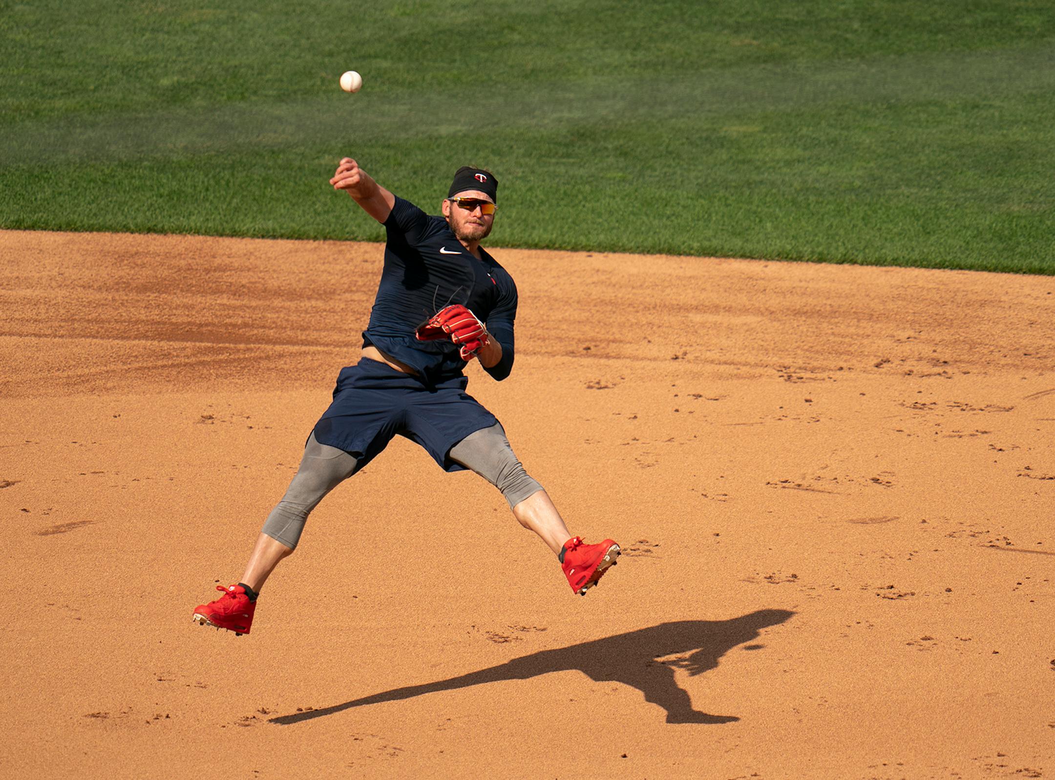 Twins third baseman Josh Donaldson (24) threw to first during infield practice Sunday evening.