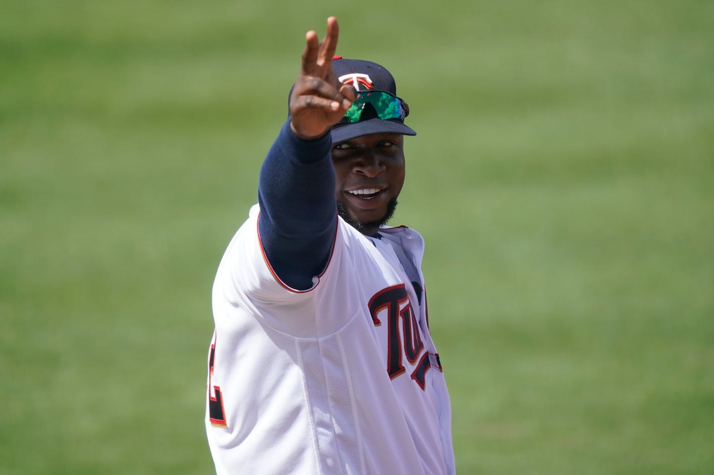 Minnesota Twins first baseman Miguel Sano waves to a cheering crowd during a spring training baseball game against the Boston Red Sox on Sunday, Feb. 28, 2021, in Fort Myers, Fla. (AP Photo/Brynn Anderson)