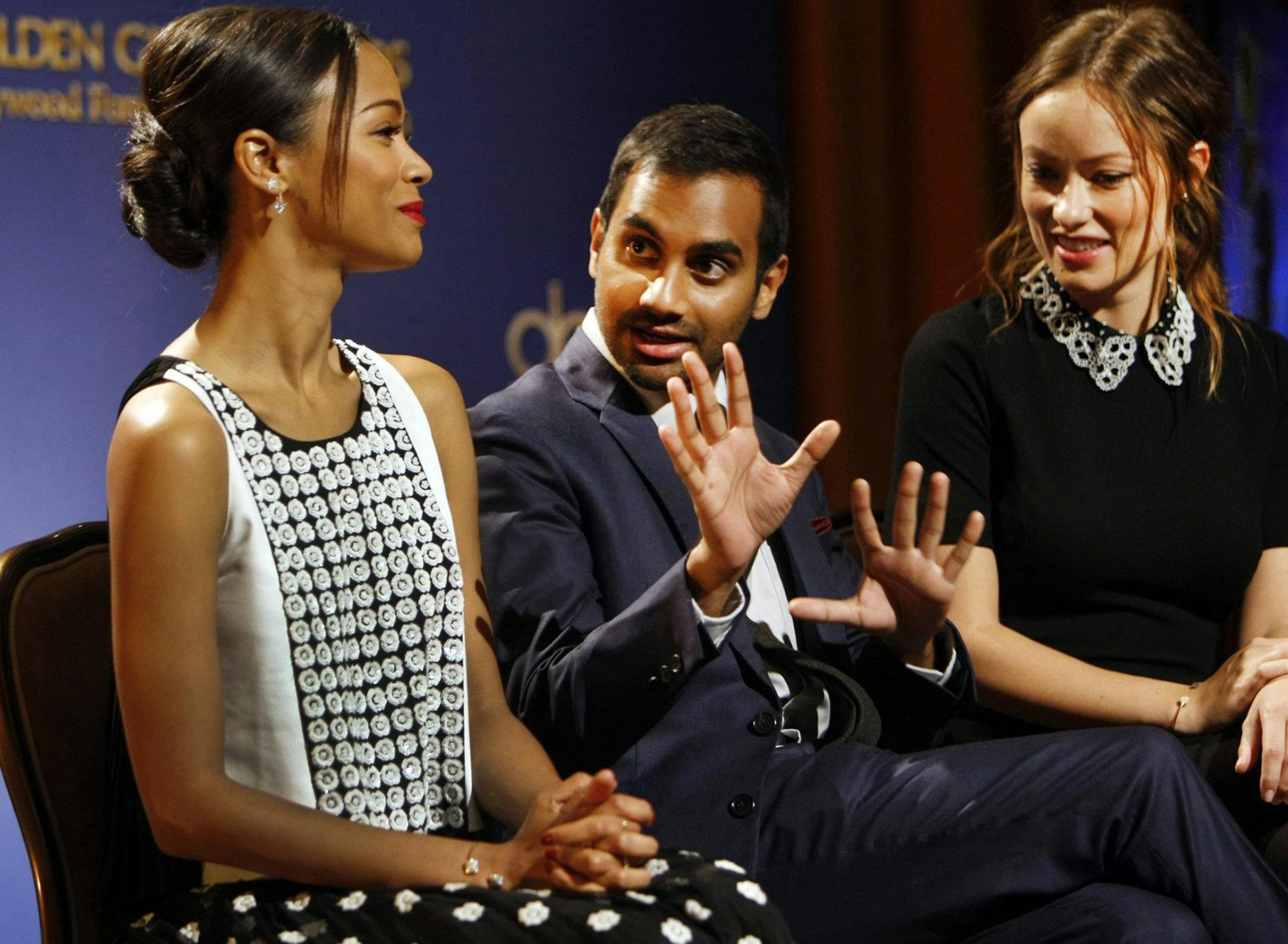 Zoe Saldana, from left, Aziz Ansari and Olivia Wilde laugh as they announce nominations for the Golden Globe Awards on Dec. 12, 2013, in Los Angeles. (Al Seib/Los Angeles Times/MCT)