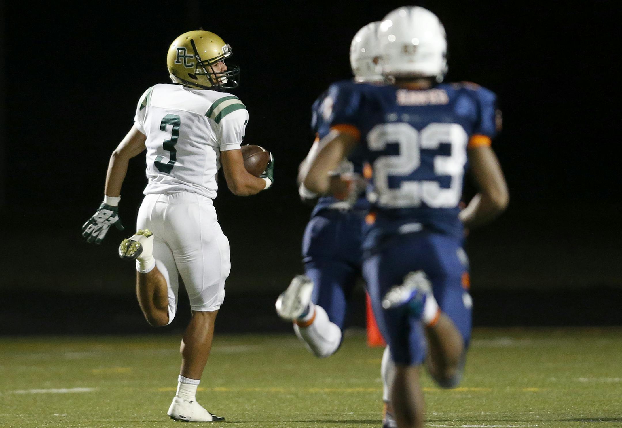 Amani Hooker (3) of Park Center ran away from Cooper defenders during a 74-yard catch and run for a touchdown in the first quarter. ] CARLOS GONZALEZ ï cgonzalez@startribune.com - October 20, 2015, New Hope, MN, Cooper High School, Prep football playoff game, Park Center at Cooper
