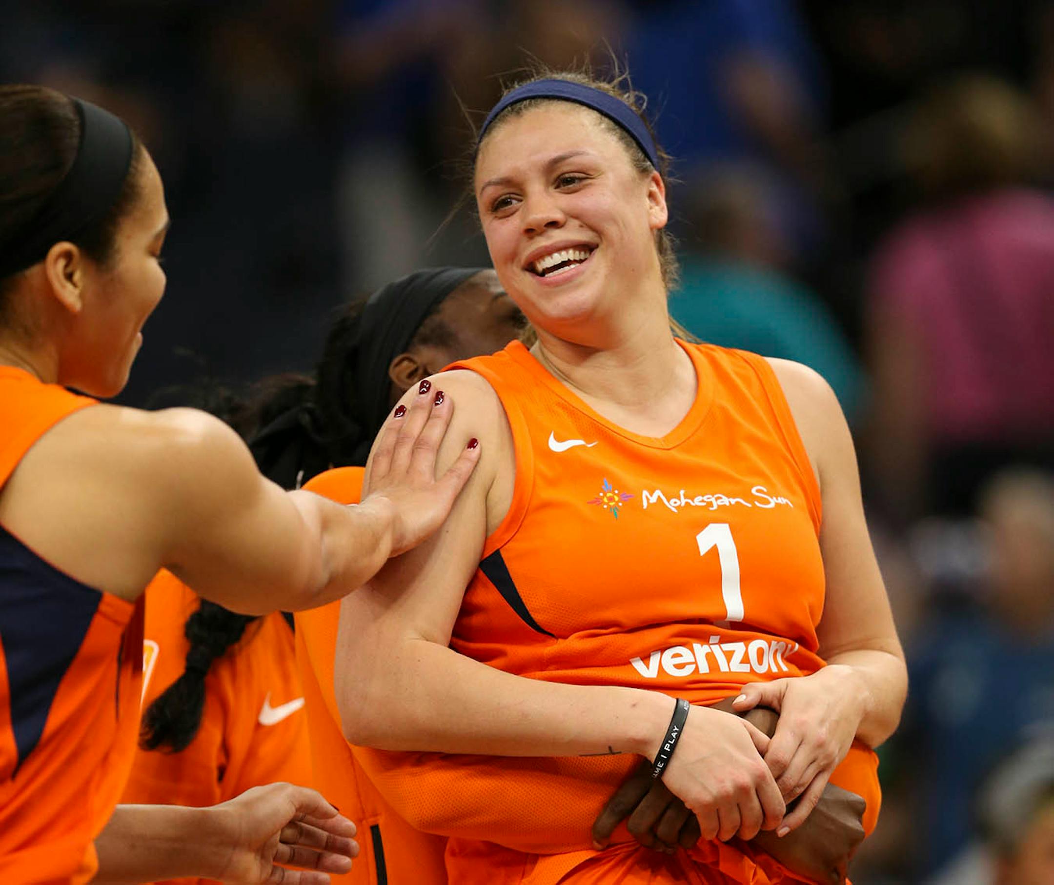 After her teammates sung Happy Birthday to her after the game, former Gopher Rachel Banham was lifted up by teammate Chiney Ogwumike and congratulated by Brionna Jones, left. Banham turned 25 Sunday and scored 11 points.