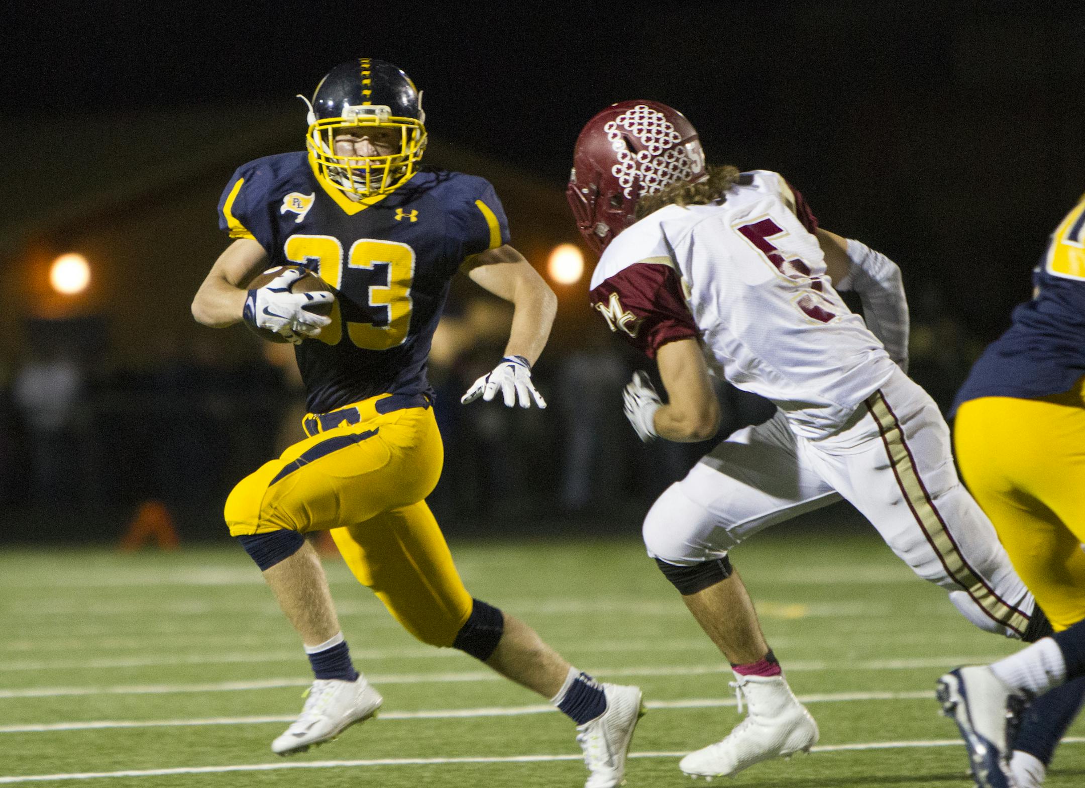 Prior Lake 23 WR Trey Blanshan prepares to collide with Maple Grove 5 LB Peter Doyle as the Prior Lake Lakers host the Maple Grove Crimson on October 2, 2015. [Special to Star Tribune Matt Blewett ï matt@mattebphoto.com 20041350A SLUG:PREP100315.prior]