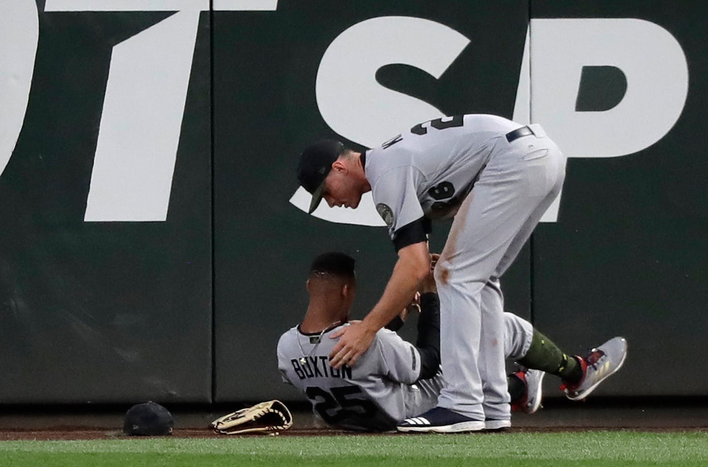 Twins center fielder Byron Buxton (left, being checked by right fielder Max Kepler after Buxton ran into the outfield wall May 26 in Seattle) was reinstated from his rehabilitation assignment, activated from the disabled list and optioned to Class AAA Rochester on Monday.