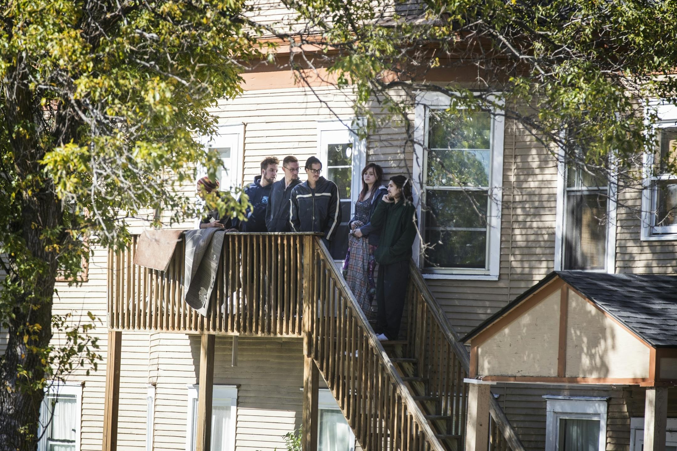 Potential witnesses are held on the scene of the shooting to be questioned by police.