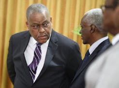 Haitian Prime Minister Garry Conille, left, speaks to Transitional Council President Edgard Leblanc Fils, during Conille's swearing-in ceremony in Por