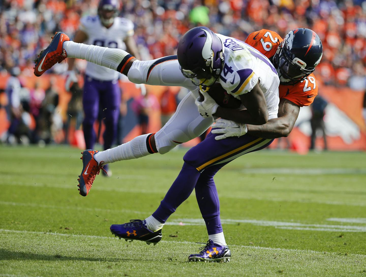 Denver Broncos cornerback Bradley Roby, right, tackles Minnesota Vikings wide receiver Stefon Diggs during the first half of an NFL football game, Sunday, Oct. 4, 2015, in Denver. (AP Photo/Jack Dempsey)