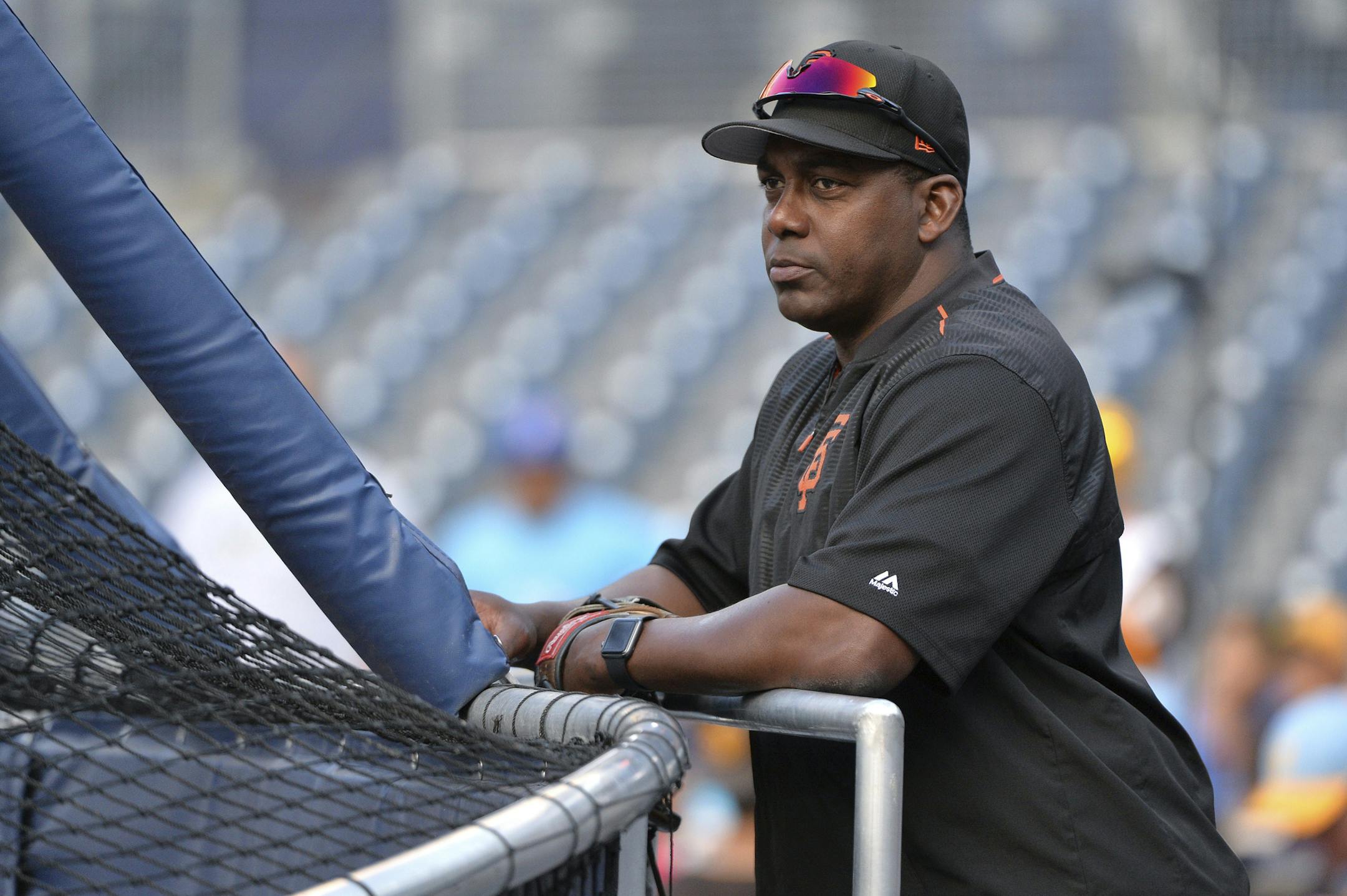 FILE - In this Aug. 28, 2017, file photo, San Francisco Giants bench coach Hensley Meulens takes in batting practice before the team's baseball game against the San Diego Padres in San Diego. Meulens has interviewed with the Cincinnati Reds for their open managerial position and also is set to meet with the Minnesota Twins this week for the job to replace Paul Molitor. Meulens was scheduled to interview in Minneapolis on Friday. A former hitting coach with the Giants when they won World Series t