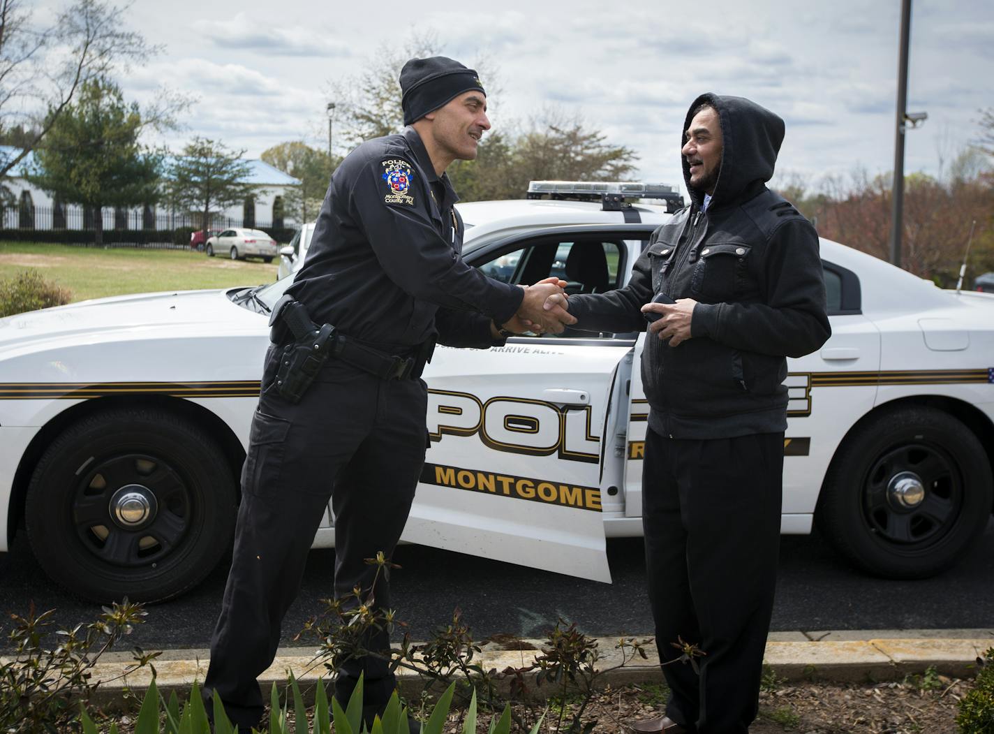 Officer Sherif Almiggabber spoke with Tulat Haddad who wanted some directions after Friday prayers at the Muslim Community Center in Silver Spring, MD. ] RENEE JONES SCHNEIDER * reneejones@startribune.com