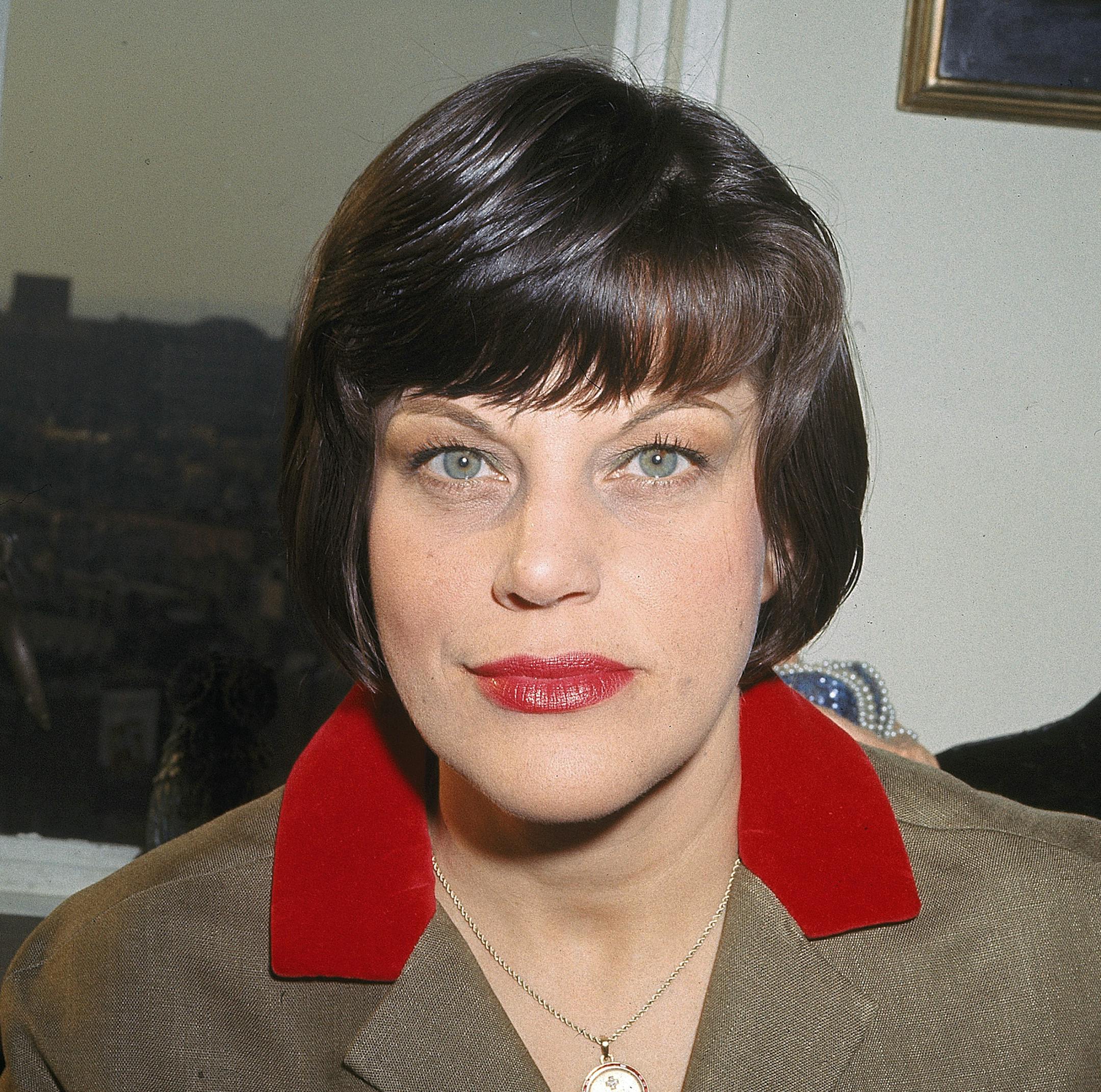 FILE - In this 1966 file photo, actress Kay Ballard poses in her home in New York. Marguerite Gordon, a friend of Ballard says the actress of the TV series “The Mothers-in-Law,” died Monday, Jan. 21, 2019, at her home in Rancho Mirage, Calif. she was 93. A boisterous comedian and singer as well as an actress, Ballard appeared in Broadway musicals and nightclubs from New York to Las Vegas. (AP Photo, File)