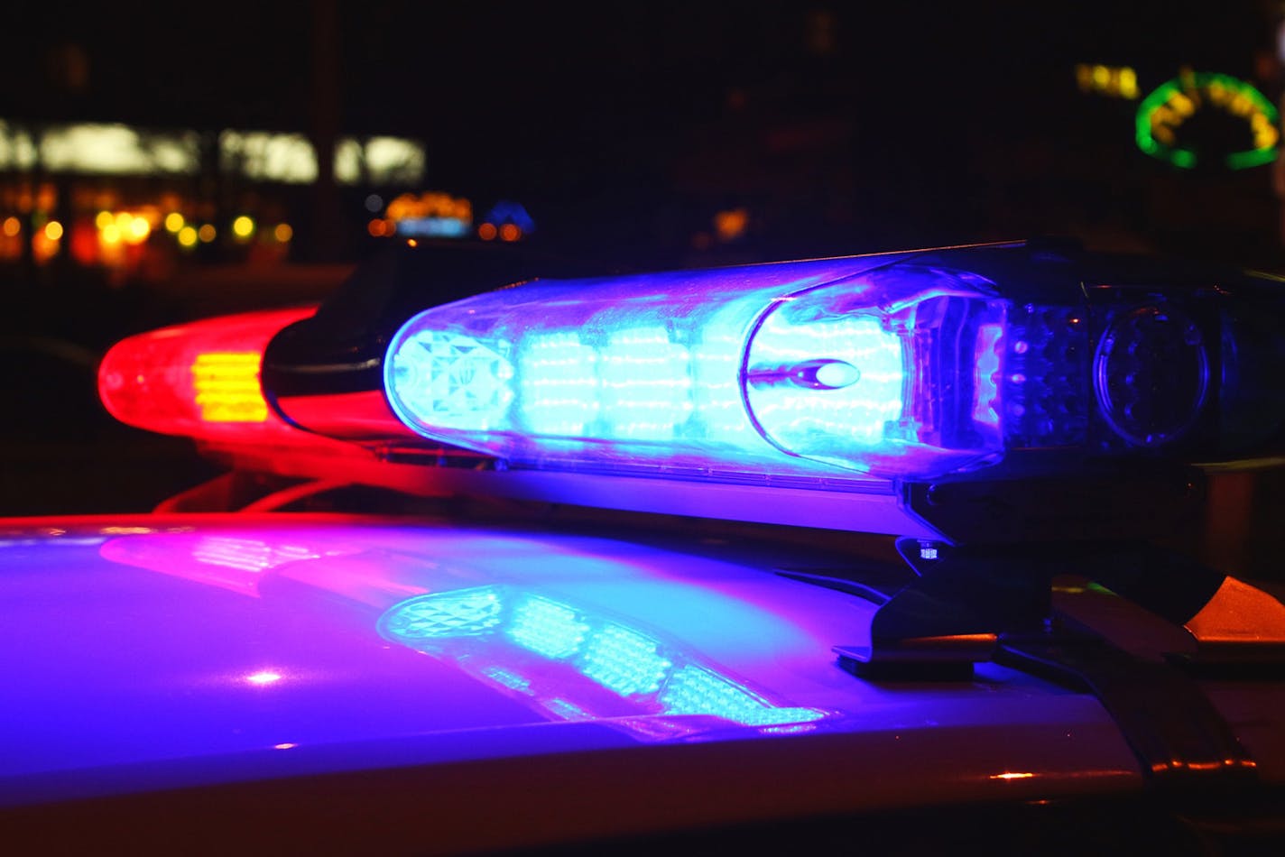 A close-up photo of police lights by night.