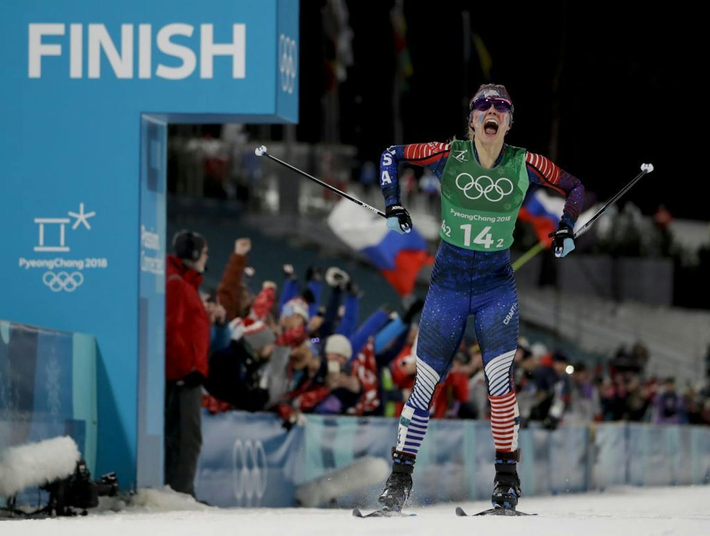 Jessie Diggins celebrates after winning the gold medal in the during women's team sprint freestyle cross-country skiing final at the 2018 Winter Olympics in Pyeongchang, South Korea, Wednesday, Feb. 21, 2018.