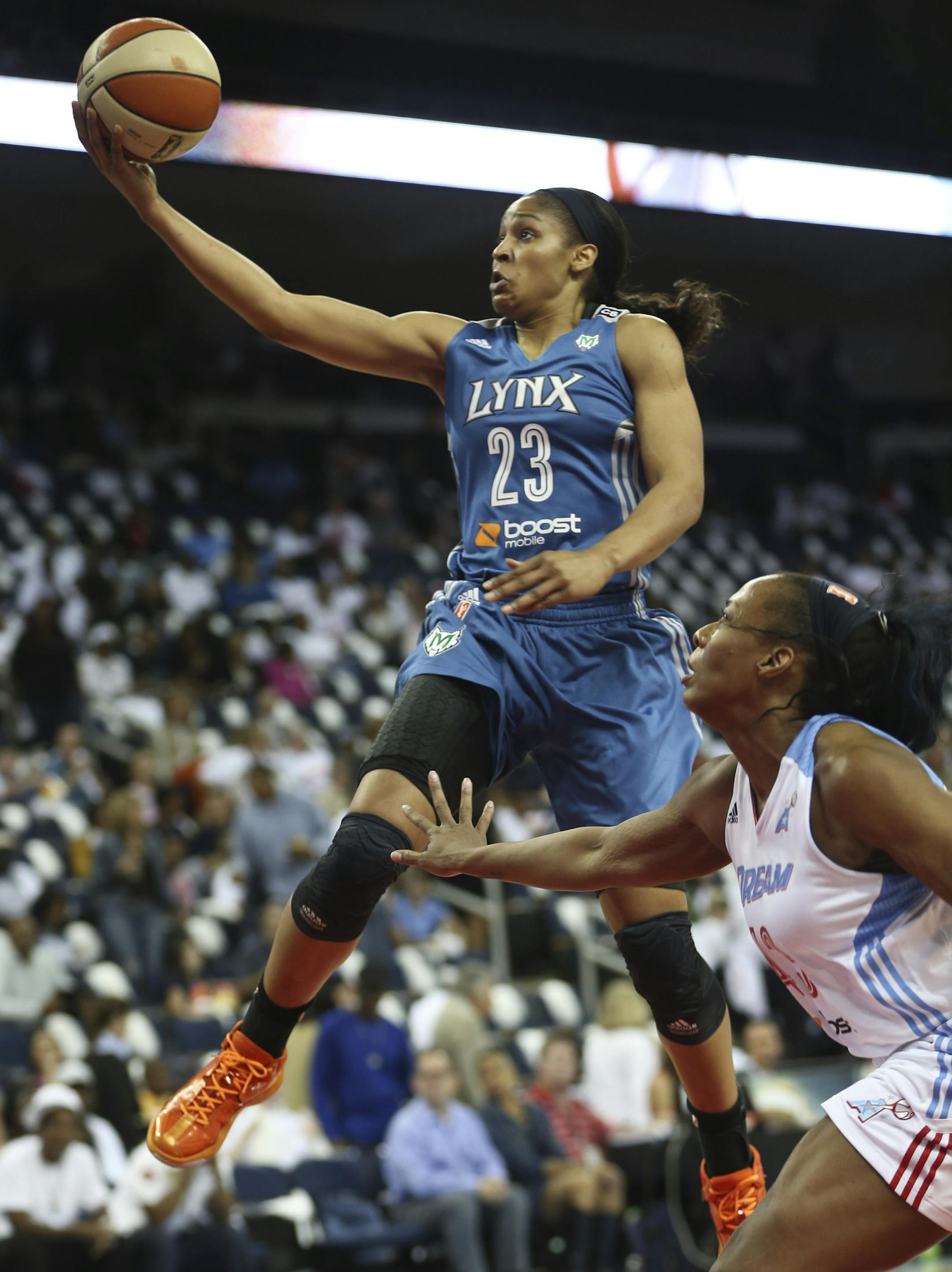 Maya Moore #23 of the Minnesota Lynx goes up for two points over Le'coe Willingham #43 of the Atlanta Dream during the first half of Game 3 of the WNBA finals on Thursday, October 10, 2013, at the Gwinnett Center in Duluth, Ga. ] RENEE JONES SCHNEIDER ‚Ä¢ reneejones@startribune.com
