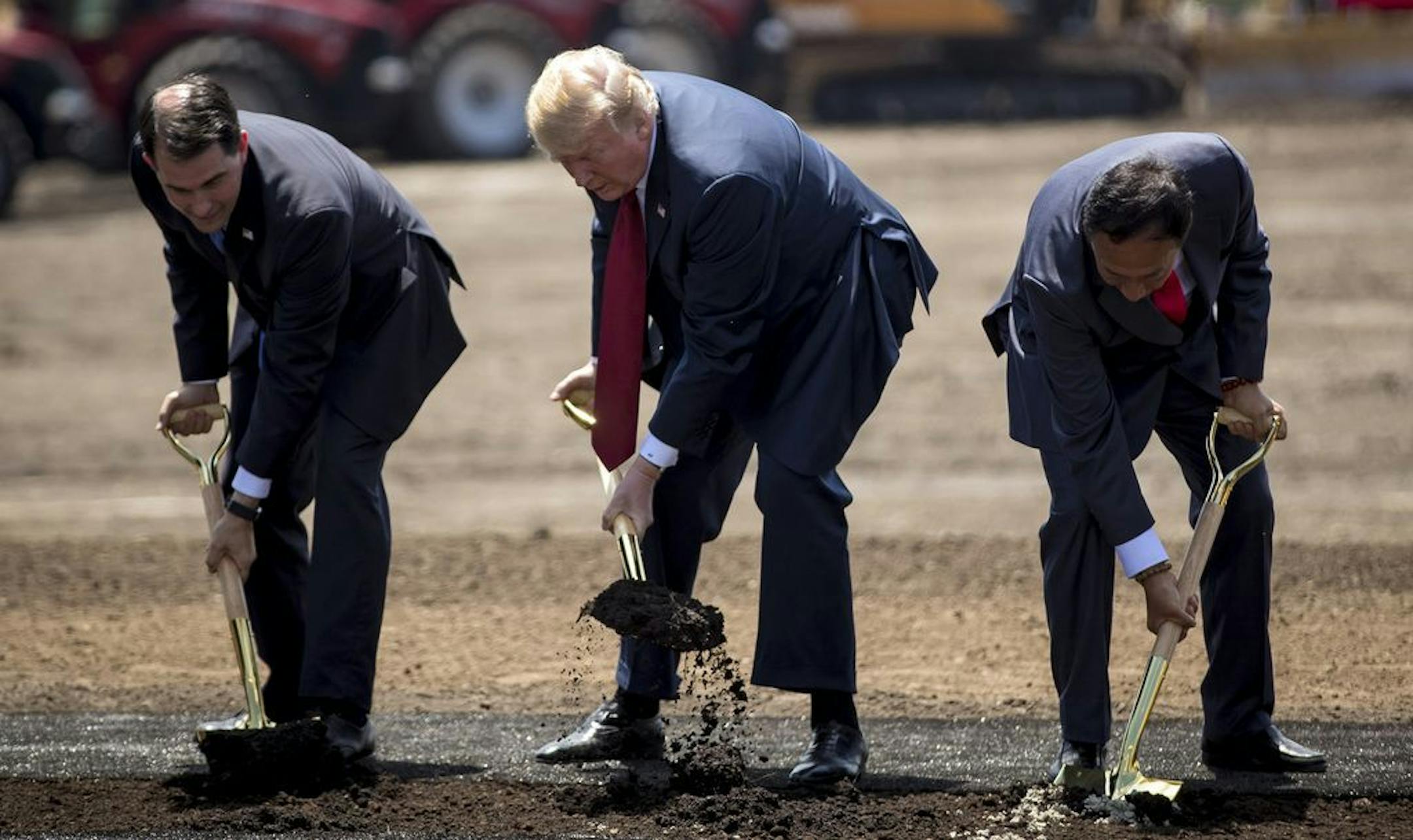 From left, Wisconsin Gov. Scott Walker, President Donald Trump and Foxconn chairman Terry Gou at a groundbreaking for the Foxconn plant Thursday, June 28, 2018 in Mt. Pleasant, Wisconsin.