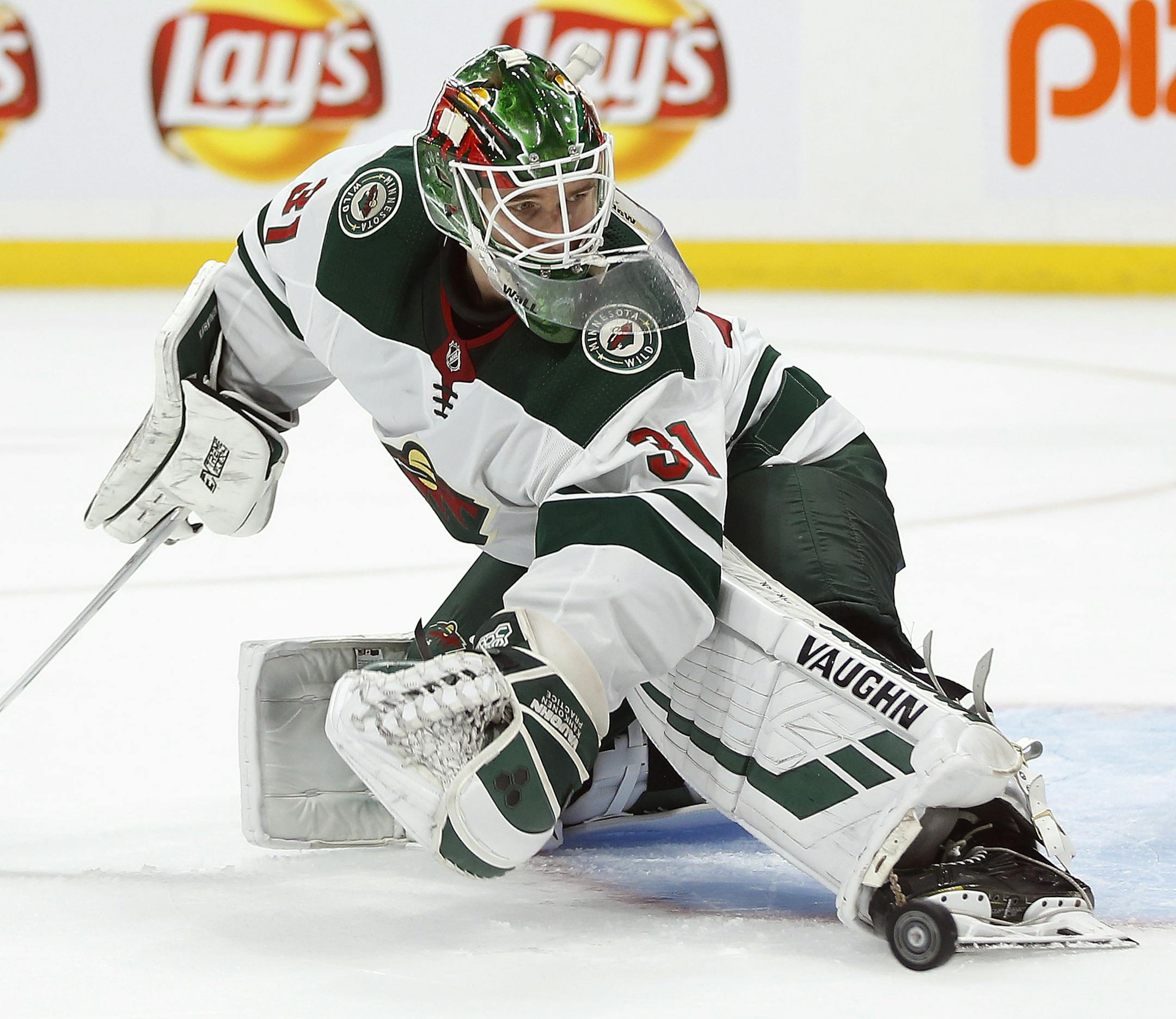 Wild goaltender Kaapo Kahkonen makes a save on a Winnipeg shot during the second period of a preseason game in September.