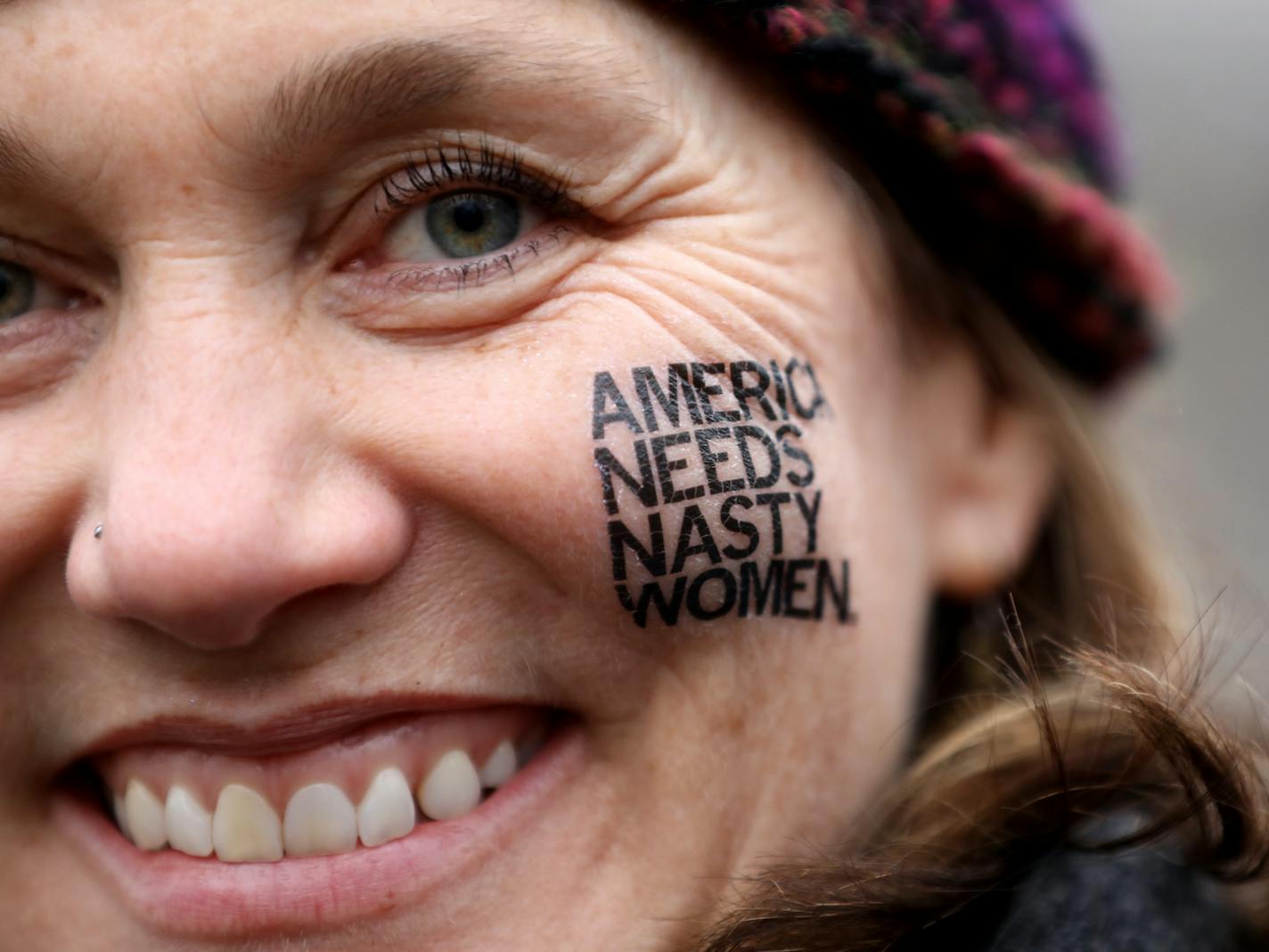 Holly Baker of Minneapolis wore a face tatto at the Women's March in Washington in Washington D.C., on Saturday, January 21, 2017. ] RENEE JONES SCHNEIDER * reneejones@startribune.com. 100s of Minnesotans came to D.C. For the Women's March on Washington.