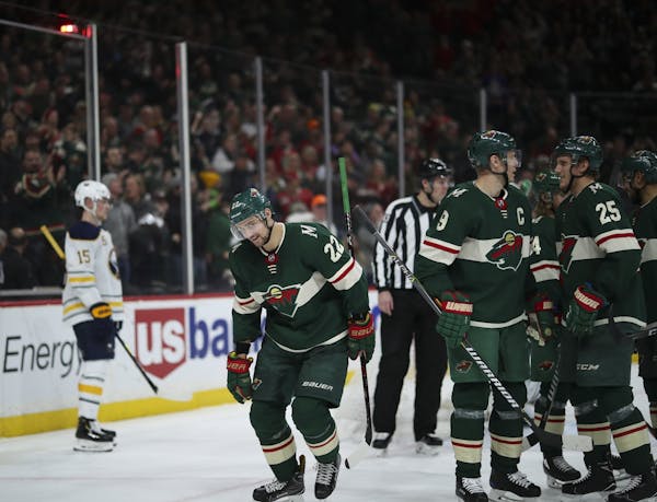 Minnesota Wild right wing Nino Niederreiter (22) headed to the bench after he celebrated his hat trick with his line mates in the second period.