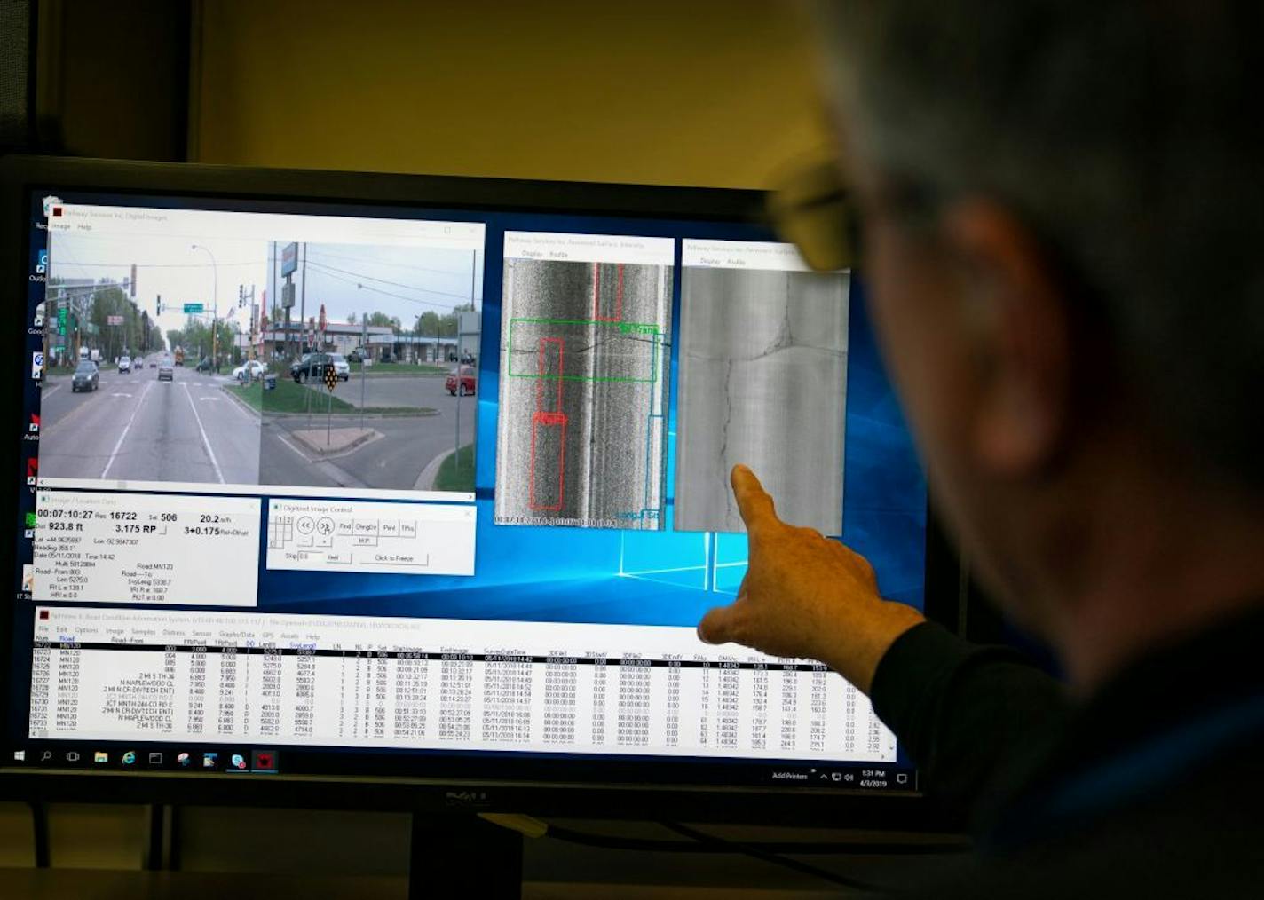 MNDOT pavement engineer Dave Janisch pointed out cracks and flaws in the road from data gathered by the automated road and pavement conditions survey vehicle, with its lasers and 3-D cameras.