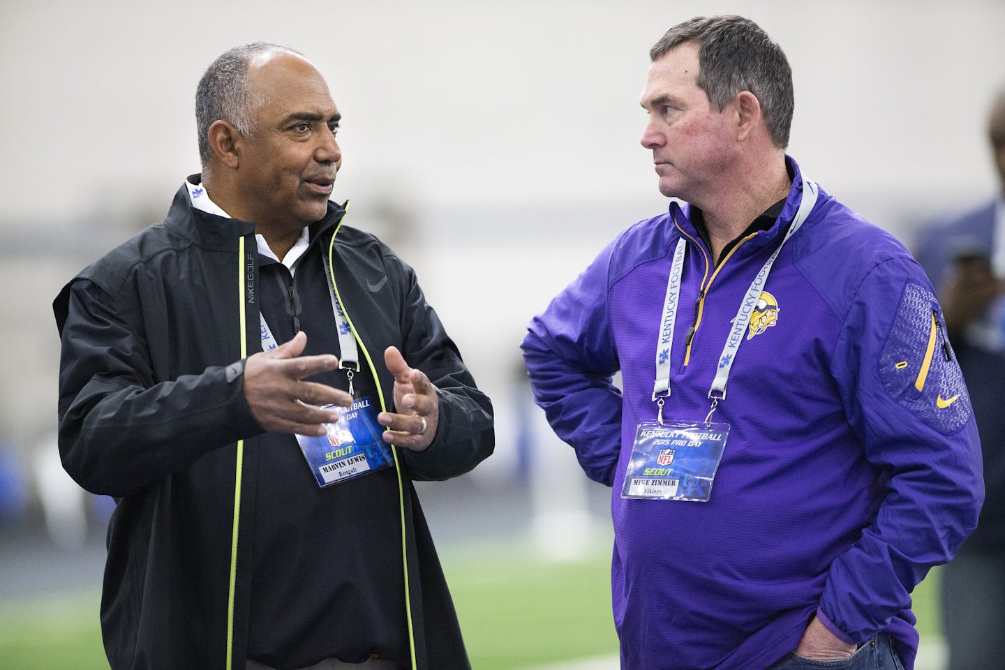 Bengals coach Marvin Lewis, left, and Vikings coach Mike Zimmer, chat with each other during NFL Pro Day at the University of Kentucky in 2015.