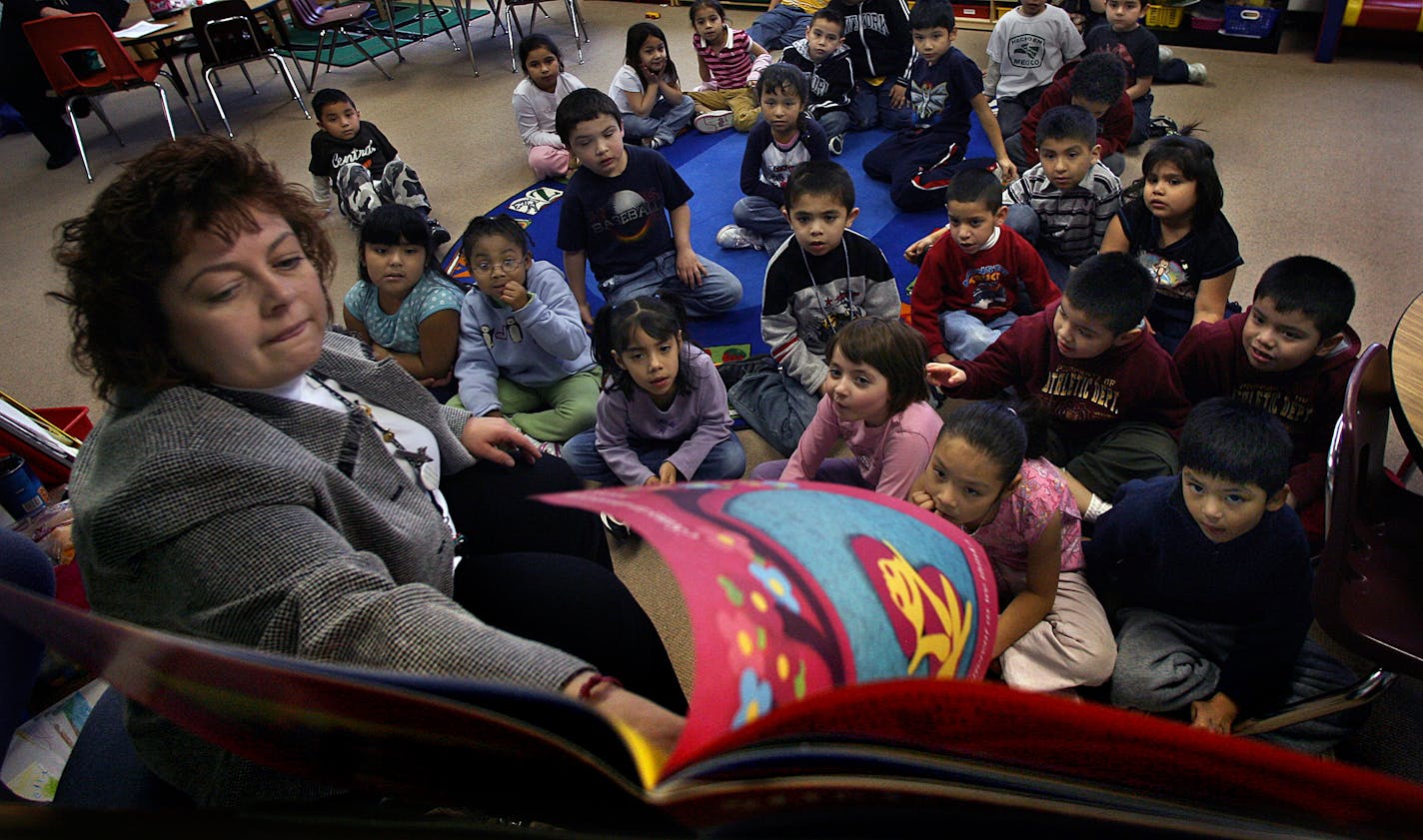 Kindergarten teacher Jennifer Nelson read a book written in Spanish to her bilingual class at Paul and Sheila Wellstone Elementary School in St. Paul.