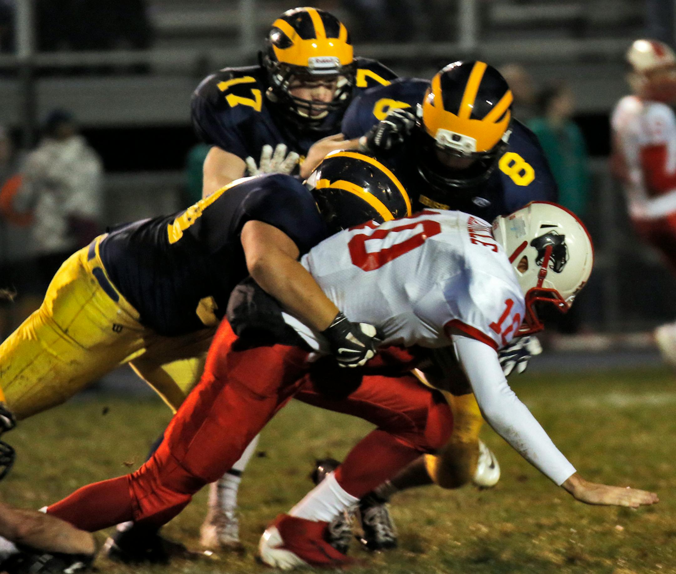 Rosemount defenders brought down Lakeville North quarterback Drew Stewart for a loss. The Irish are one of the surprise teams from this high school football season.