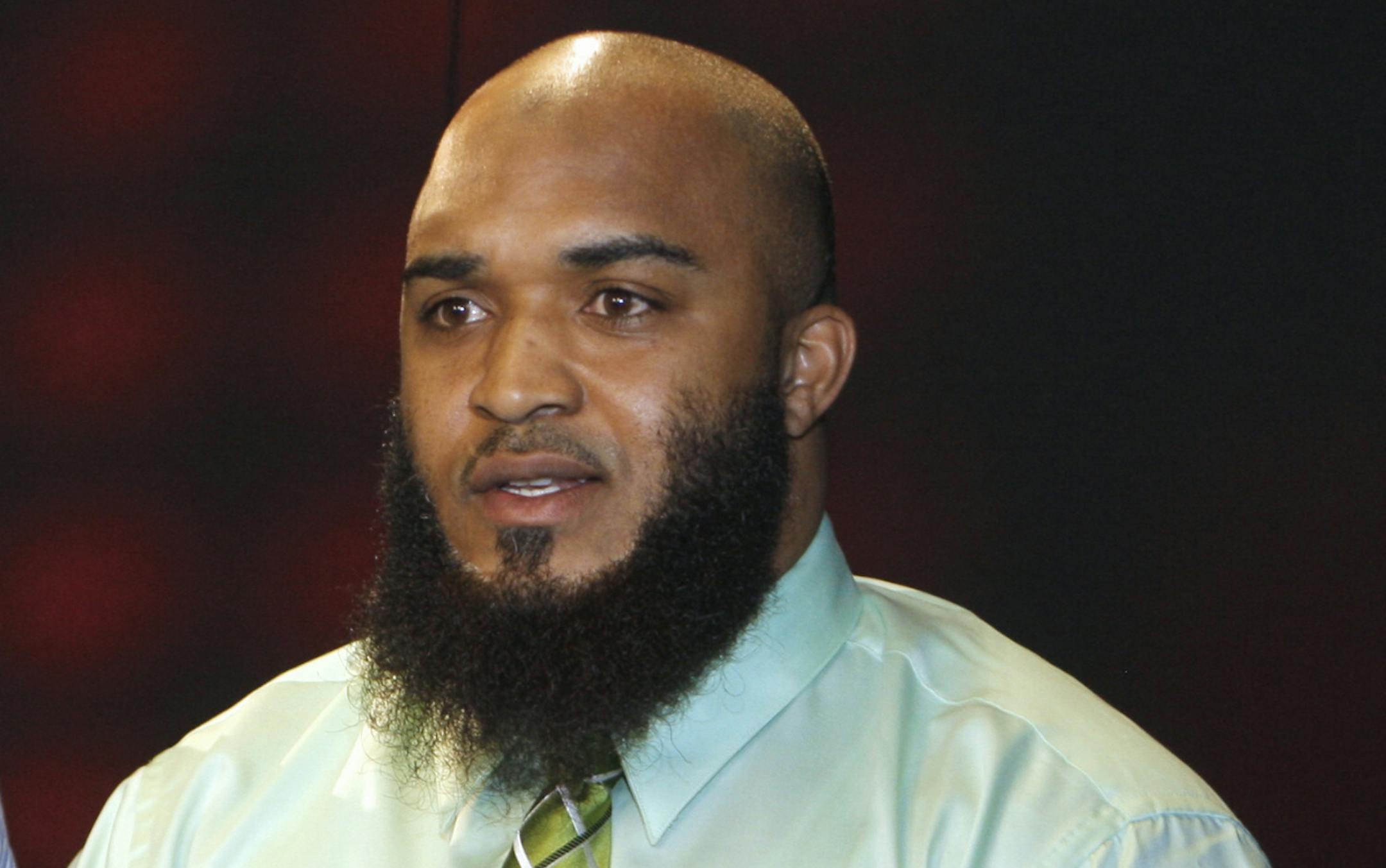 FILE - This Feb. 14, 2011, file photo, shows Abdullah al-Kidd in Los Angeles. Al-Kidd, an American Muslim man, said he was wrongly imprisoned as a material witness in a terrorism case against another man. He has reached a settlement with the U.S. government after more than a decade of court battles. The American Civil Liberties Union, which represented al-Kidd in the lawsuit, announced the settlement Friday, Jan. 16, 2015. (AP Photo/Damian Dovarganes, File)