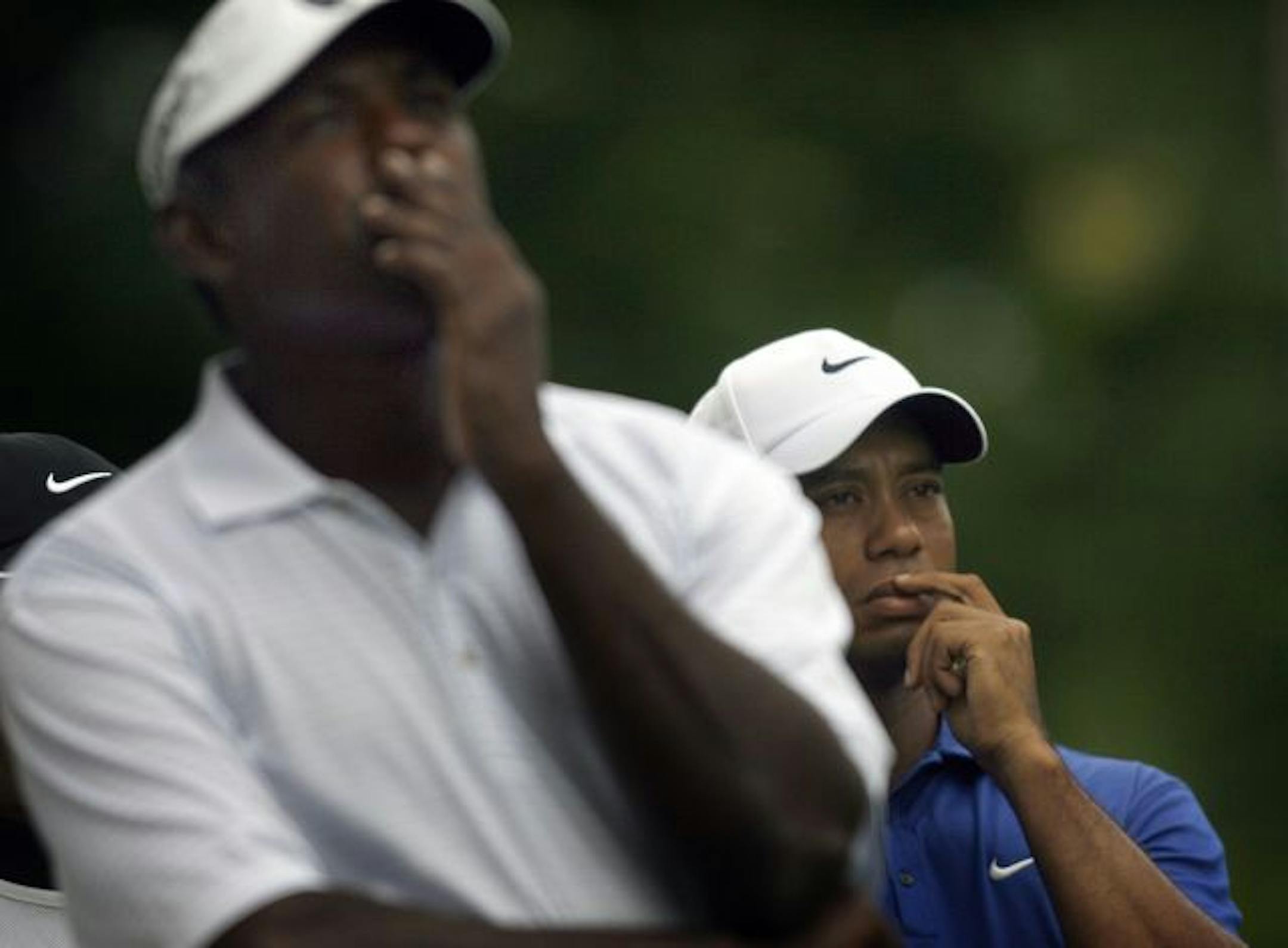 JIM GEHRZ � jgehrz@startribune.comChaska/August 15, 2009/10:30 AMTiger Woods and Vijay Singh (left) waited for the wind to die down as a weather front approached on the 13th tee during third round play at the 91st PGA Championship at Hazeltine National Golf Club in Chaska.