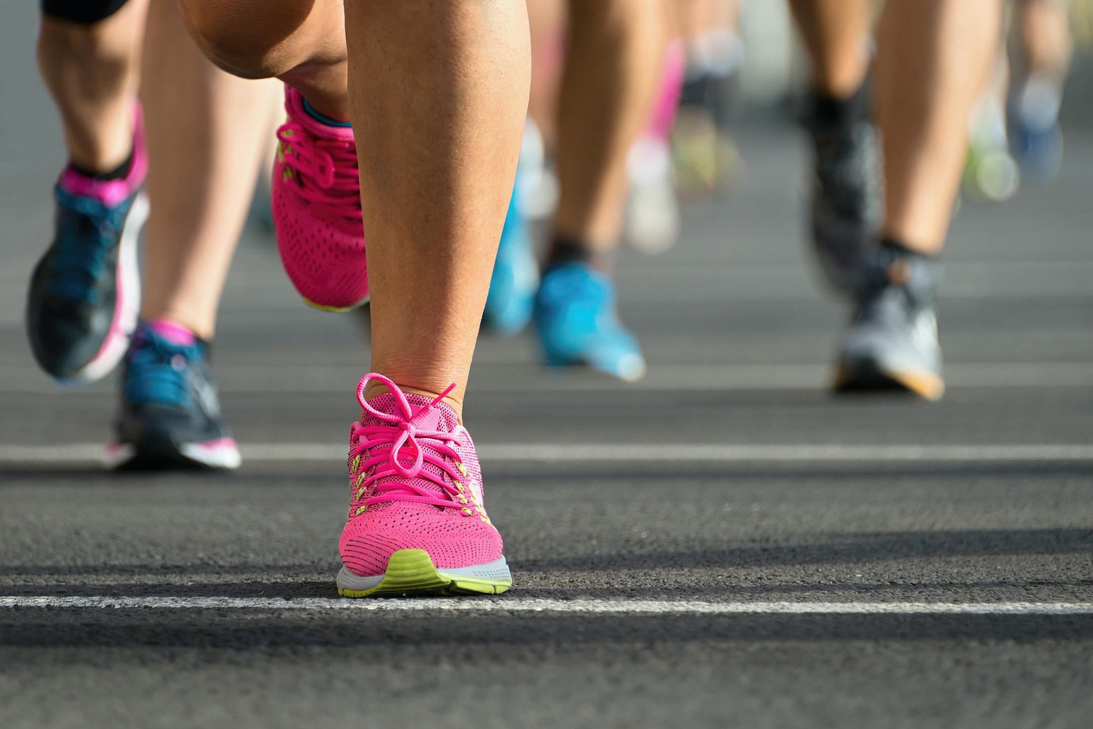 Marathon running race, people feet on city road
istock