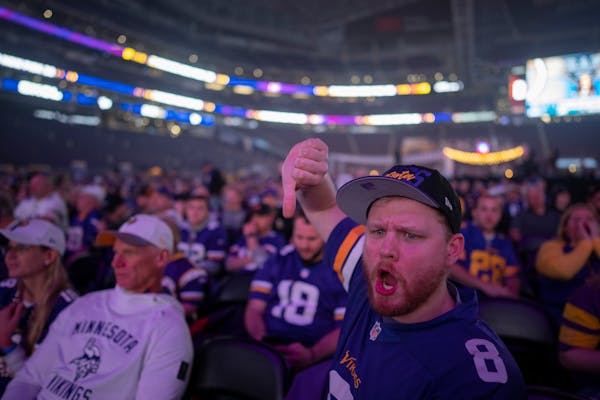 Donald Verhota booed after hearing the announcement that the Vikings traded their No. 12 pick for No. 32.