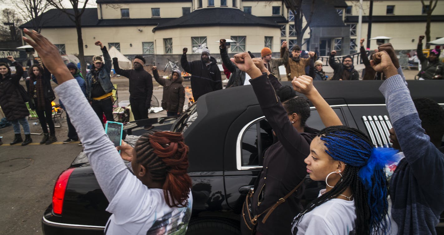 At the funeral procession for Jamar Clark at the Police 4th Precinct, family members got out of the limousine to show show support for the Black Lives Matter supporters. ]Richard Tsong-Taatarii/rtsong-taatarii@startribune.com