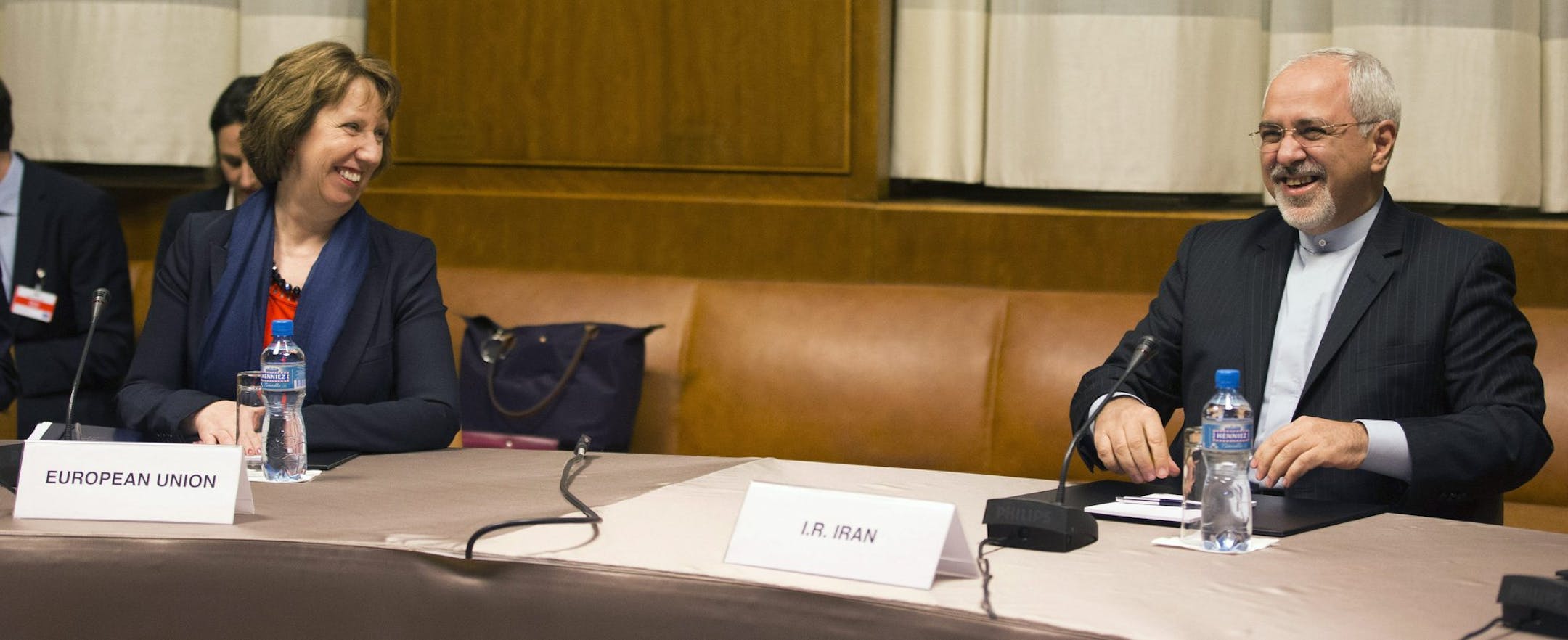 EU High Representative for Foreign Affairs Catherine Ashton, left, speaks with Iranian Foreign Minister Mohammad Javad Zarif, right, during a photo opportunity prior to the start of three days of closed-door nuclear talks in Geneva, Switzerland, Wednesday, Nov.20, 2013. (AP Photo/Keystone,Salvatore Di Nolfi)