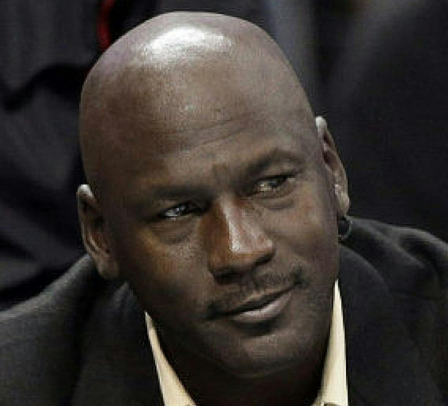 Charlotte Bobcats owner Michael Jordan watches during the first half of an NBA basketball game between the Bobcats and the Chicago Bulls in Charlotte, N.C., Wednesday, April 16, 2014. (AP Photo/Chuck Burton) ORG XMIT: NCCB106