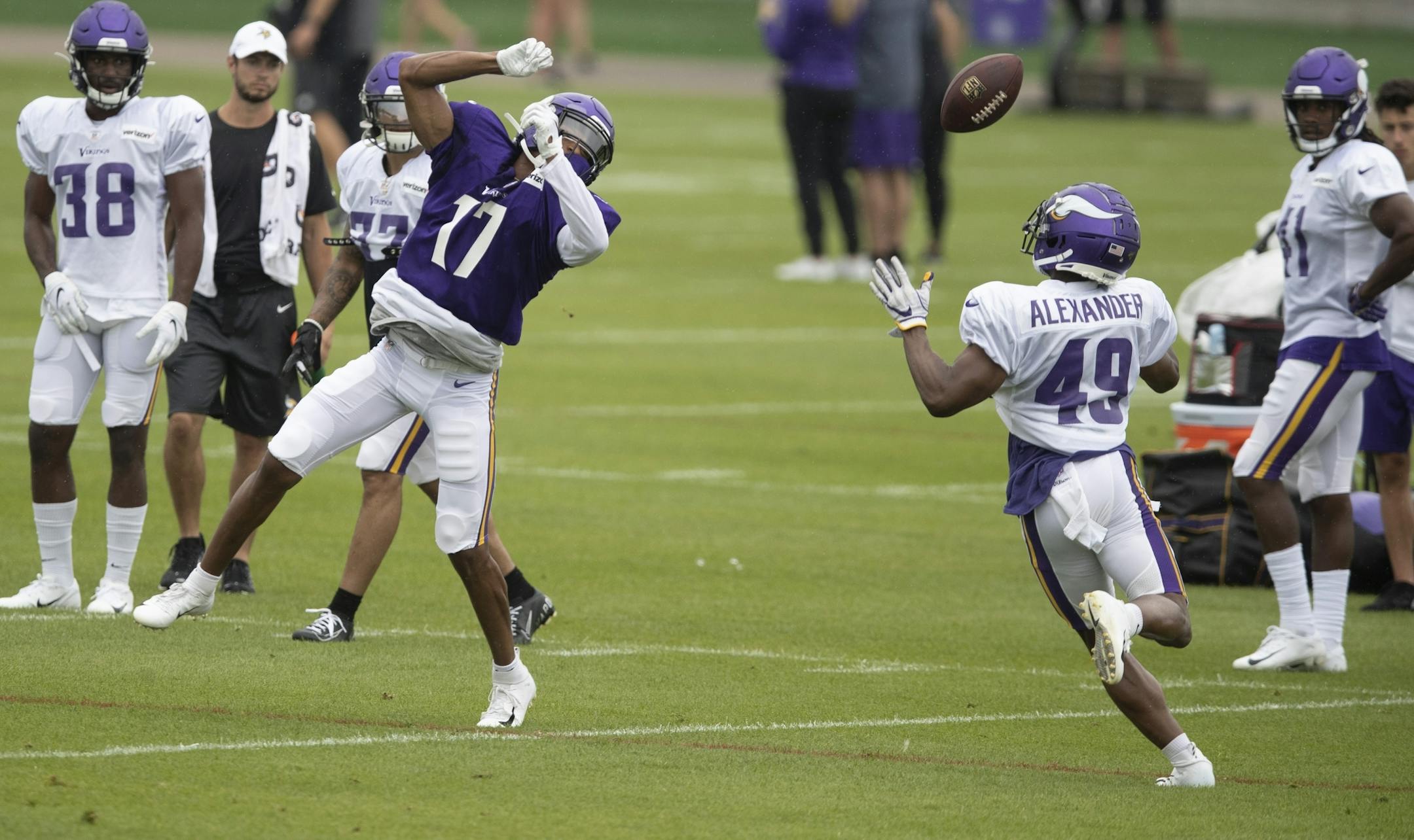 Minnesota Vikings wide receiver Dillon Mitchell (17) got his shoulder pads stuck on his helmet and the ball was tipped to cornerback Terrence Alexander (49) during practice at TCO Performance Center on Sunday July, 28 2019 in Eagan, MN.