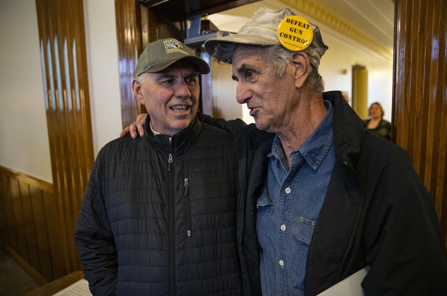 (Left) Steve Piragis and Seraphine Rolando greeted one another and talked before the start of the Ely town council meeting on Wednesday. Piragis and Rolando have opposing views on the issues currently plaguing Ely but love and respect one another nonetheless. ]
ALEX KORMANN &#x2022; alex.kormann@startribune.com Over one hundred people turned out to Ely, MN for the town council meeting to show support for or against two resolutions. The first resolution was to support the Twin Metals and Polymet