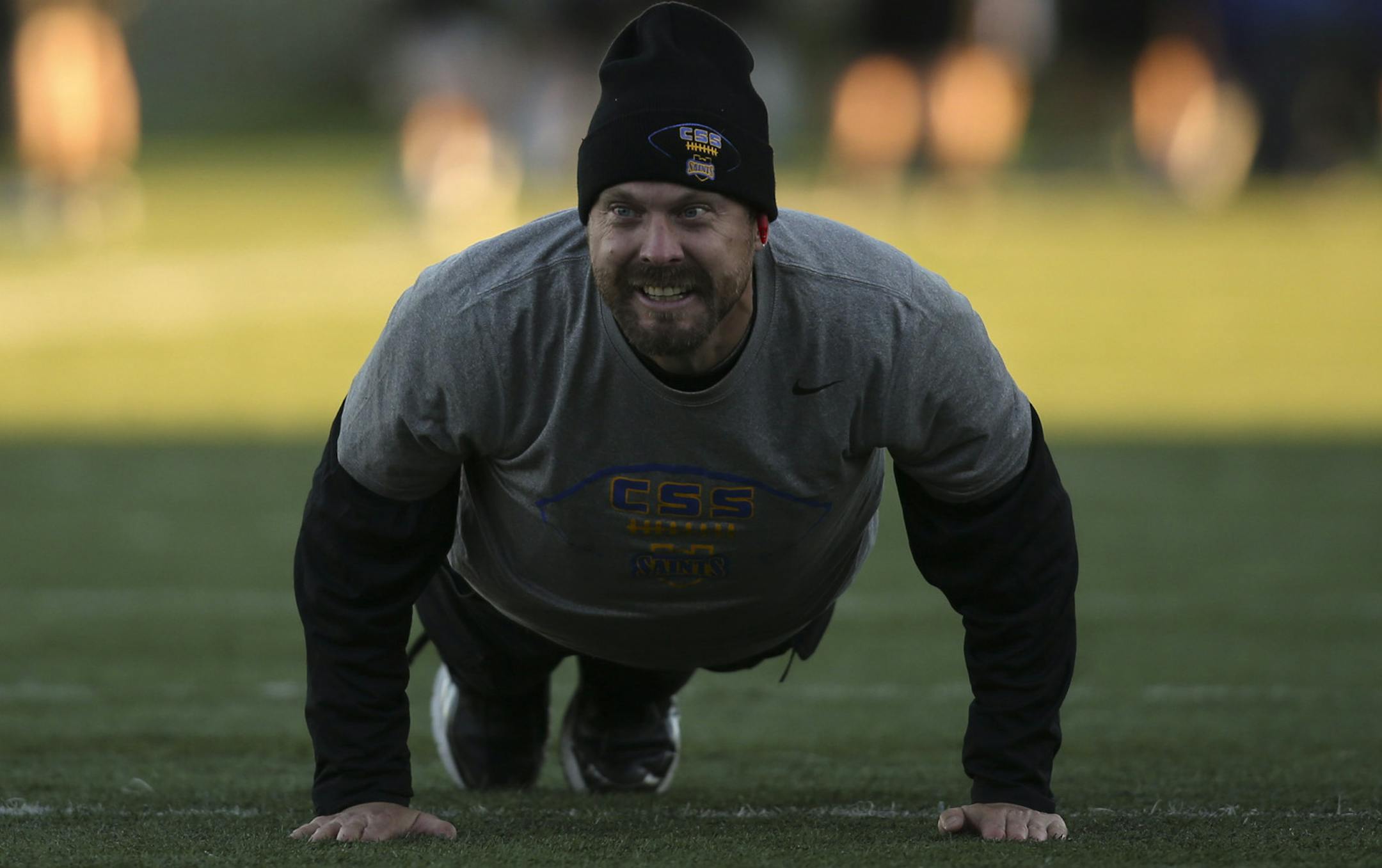 St. Scholastica football coach Kurt Ramler did push ups after his players successfully ran a play during practice last month. ] JEFF WHEELER ‚Ä¢ jeff.wheeler@startribune.com Lisa Maurer had been an athletic coach in New Ulm schools, but figured that part of her life ended when she elected to join the monastic profession in 2009. Not so. First-year St. Scholastica football head coach Kurt Ramler heard of Sister Lisa's coaching background and passion for athletics and frequent vis