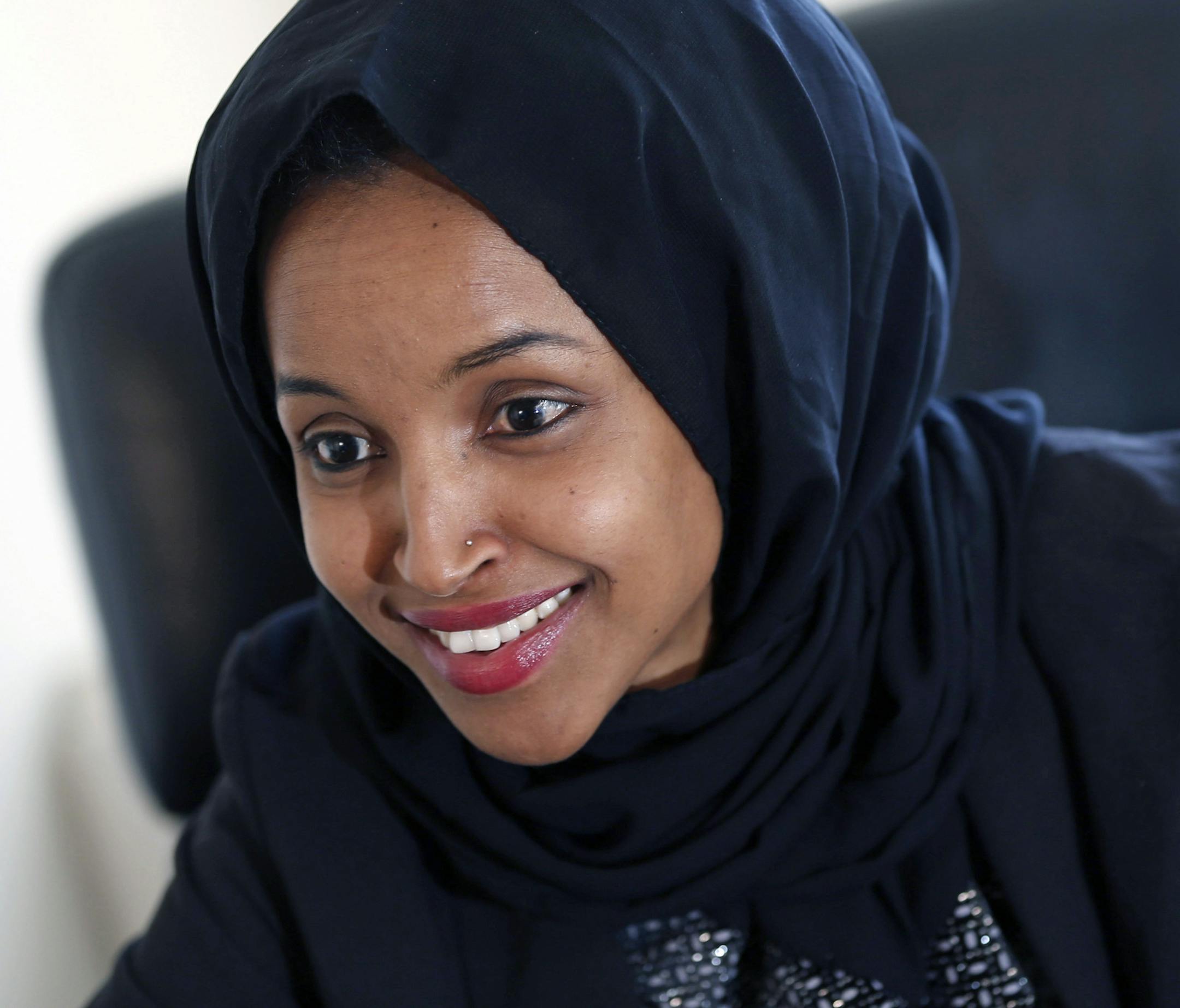 FILE - In this Jan. 5, 2017, file photo, state Rep. Ilhan Omar is interviewed in her office two days after the 2017 Legislature convened in St. Paul, Minn. Somali-American legislator Ilhan Omar made history Tuesday, Aug. 14, 2018, by winning the Democratic congressional primary in a Minneapolis-area district so reliably liberal that her victory is likely her ticket to Congress. (AP Photo/Jim Monem File)