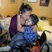 Maria Madalena Carranza placed her daughter Sarai in her wheelchair to make her way to lunch at a home where they took refuge after an emergency visit