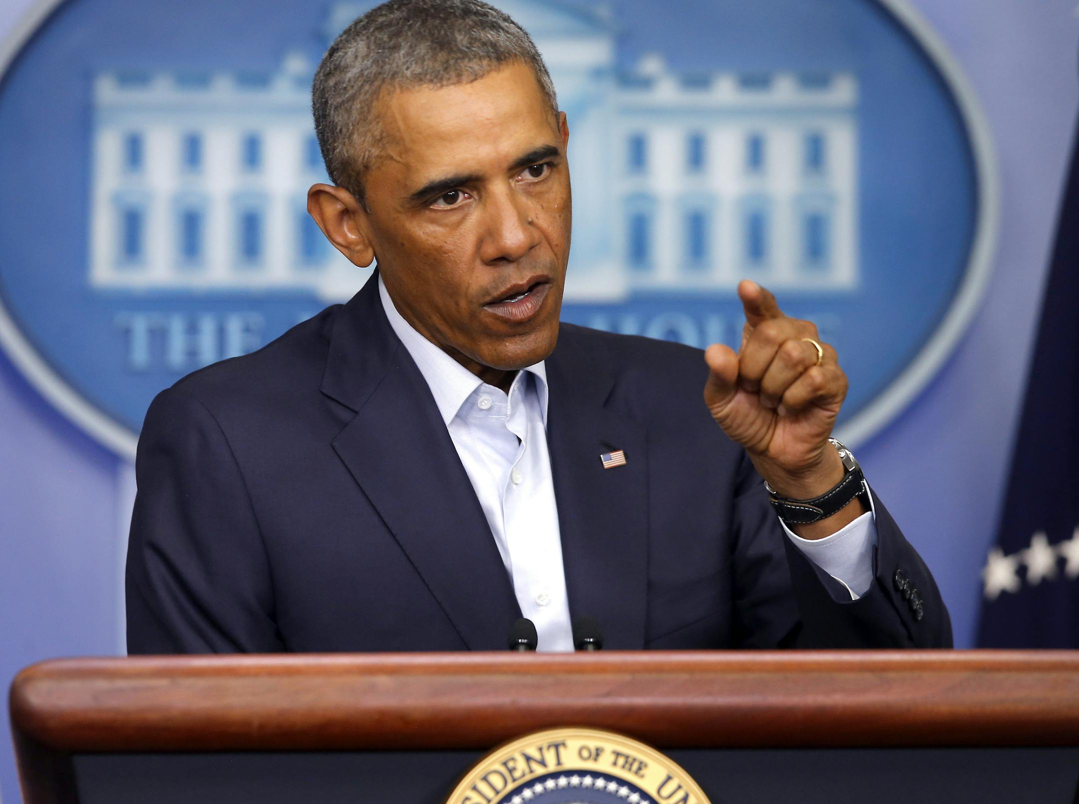 President Barack Obama answers a question in the James Brady Press Briefing Room of the White House in Washington, Monday, Aug. 18, 2014. Taking a two-day break from summer vacation, President Barack Obama met with top advisers at the White House Monday to review developments in Iraq and in racially charged Ferguson, Missouri, two trouble spots where Obama has ordered his administration to intervene. (AP Photo/Charles Dharapak)
