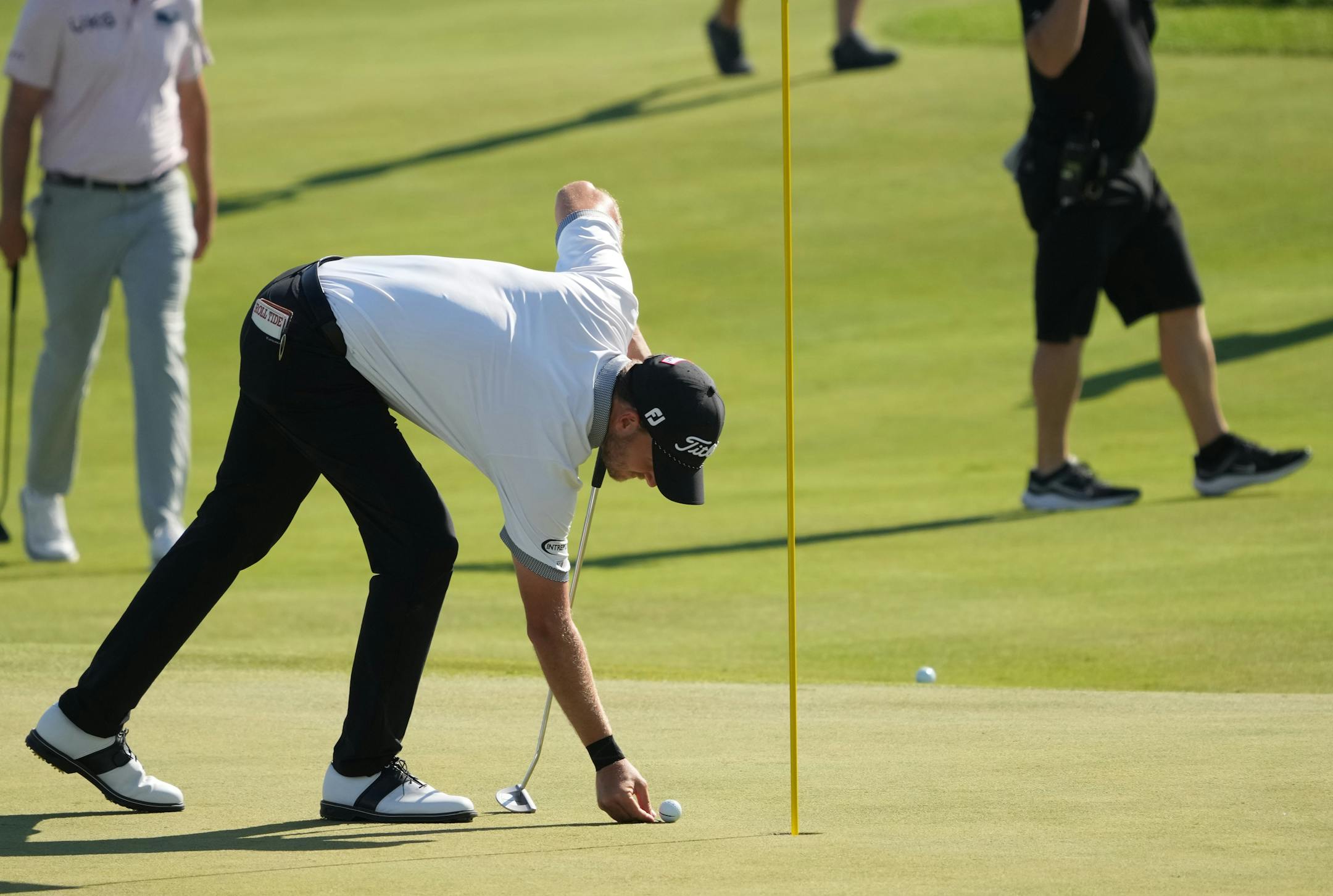 Lee Hodges marks his ball on the 18th hole of TPC Twin Cities moments before sewing up his first PGA Tour victory.