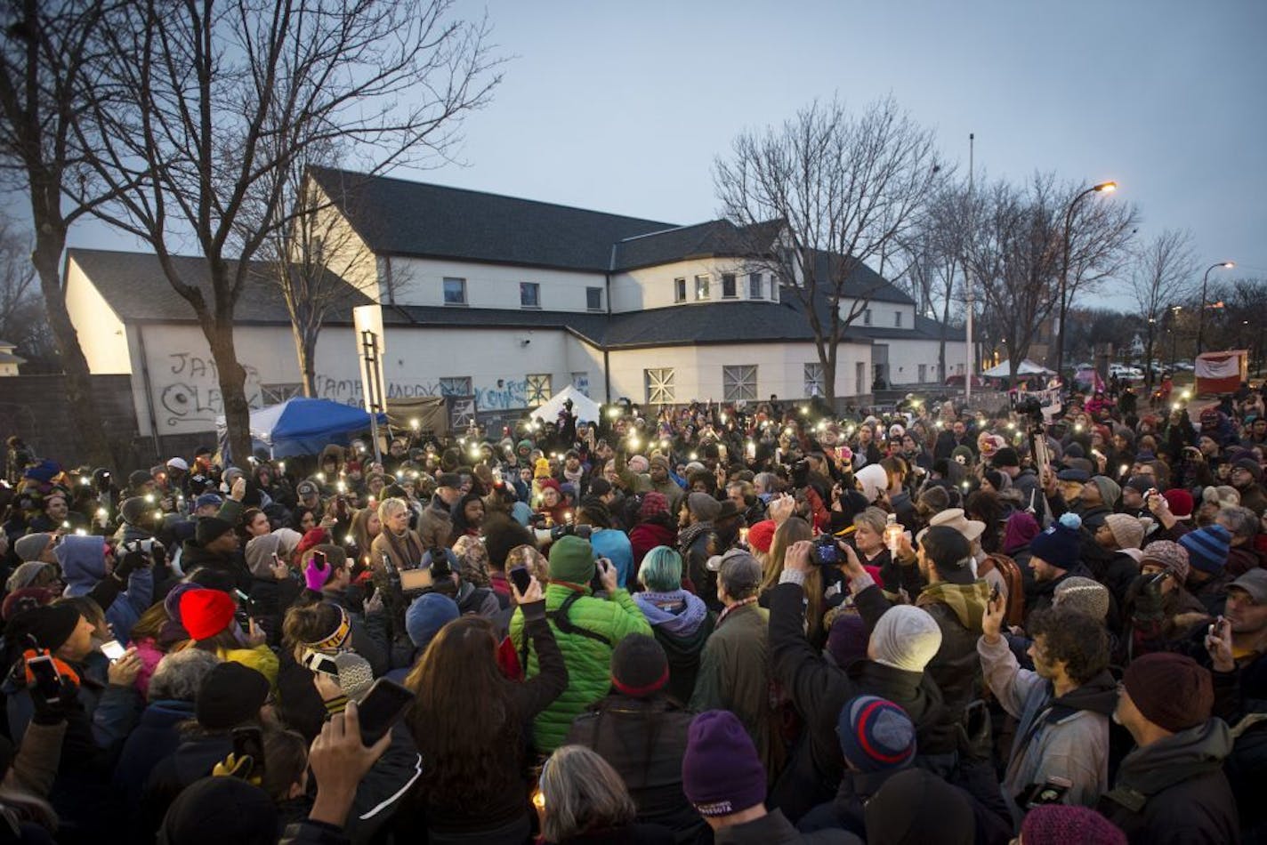 A candlelight vigil was held outside of the 4th Precinct station on Friday night.