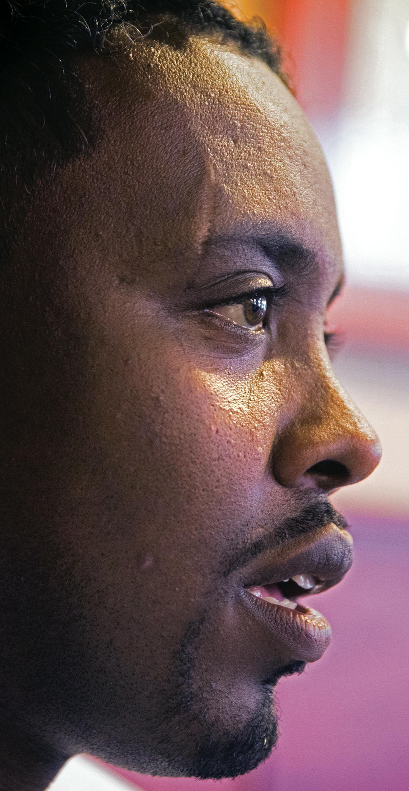 Minneapolis City Councilman Abdi Warsame talks with a young Somali-American at Mapps Coffee Riverside in Minneapolis on Friday, May 29, 2015. ] LEILA NAVIDI leila.navidi@startribune.com / ORG XMIT: MIN1505291557381324