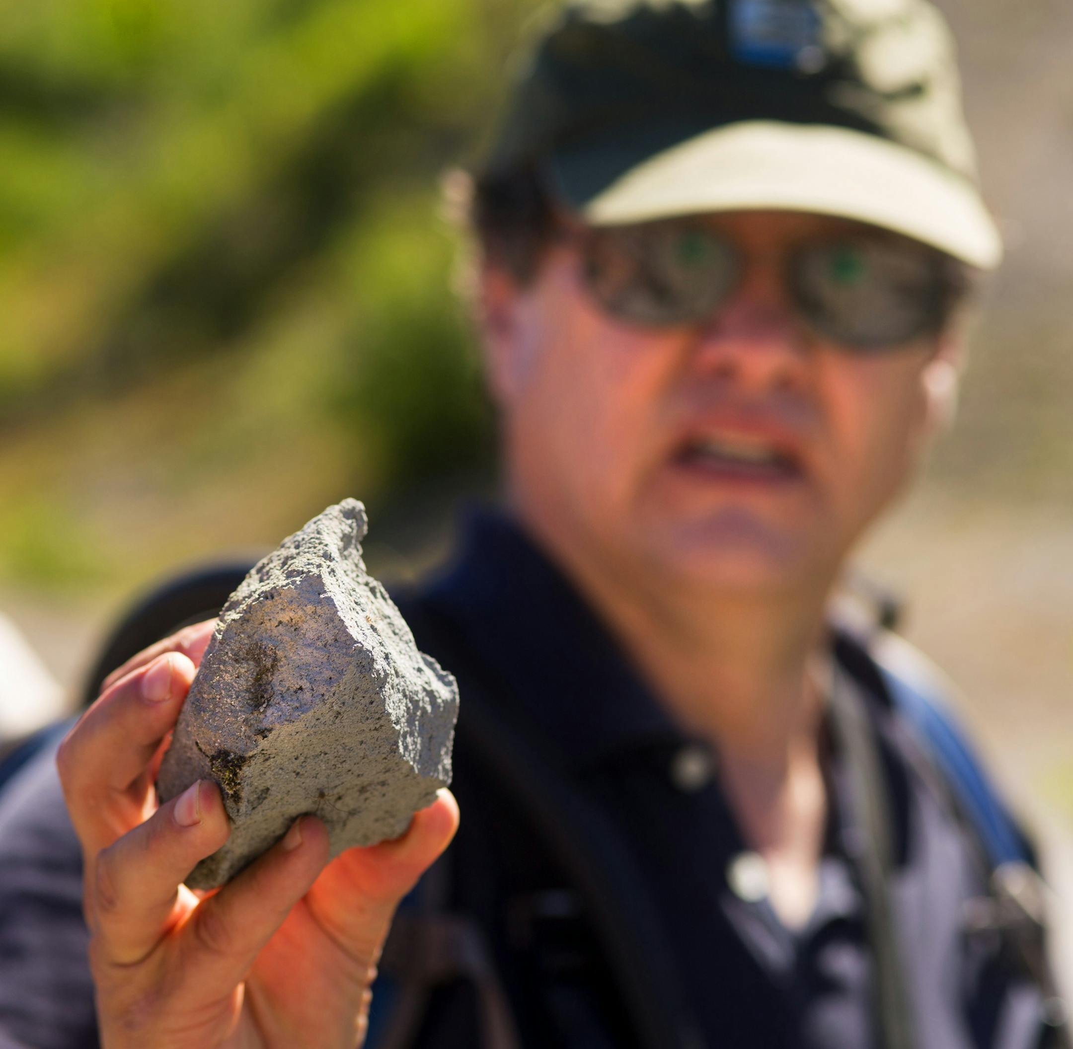 Scientist Peter Frenzen held a rock blasted during the 1980 eruption of Mount St. Helens.
