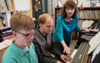 Pianists Noah Johnson (left) and Brandon Leu practiced one of their songs as teacher Diana Bearmon watched and listened. ] Shari L. Gross &#x2022; sha