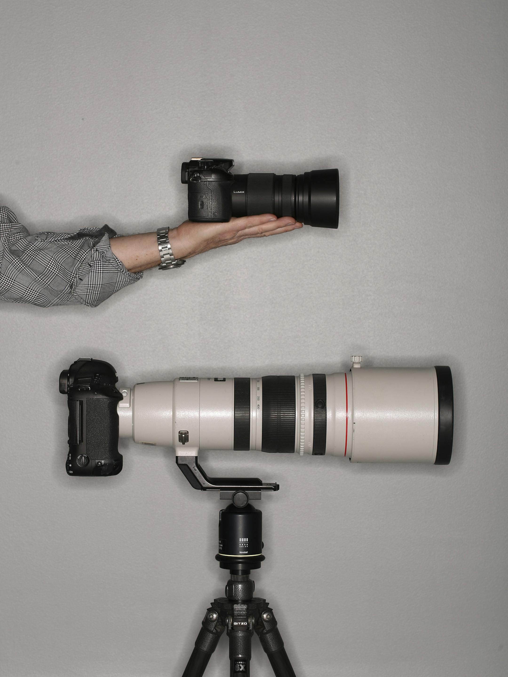 A Panasonic Lumix DMC-GH3 Micro Four Thirds camera body with a Panasonic 100-300mm f/4.0-5.6 lens, which is the 35mm equivalent of a 200-600mm lens. Below it is a Canon 1DX full frame body mounted on a Canon 200-400mm f/4 lens. ] JEFF WHEELER ï jeff.wheeler@startribune.com A Panasonic Lumix Micro Four Thirds camera body with a Panasonic 100-300mm f/2.8 lens, which is the 35mm equivalent of a 70-200 lens. Below it is a Canon 1DX body mounted on a Canon 200-400mm f/4 lens. Photographed in the